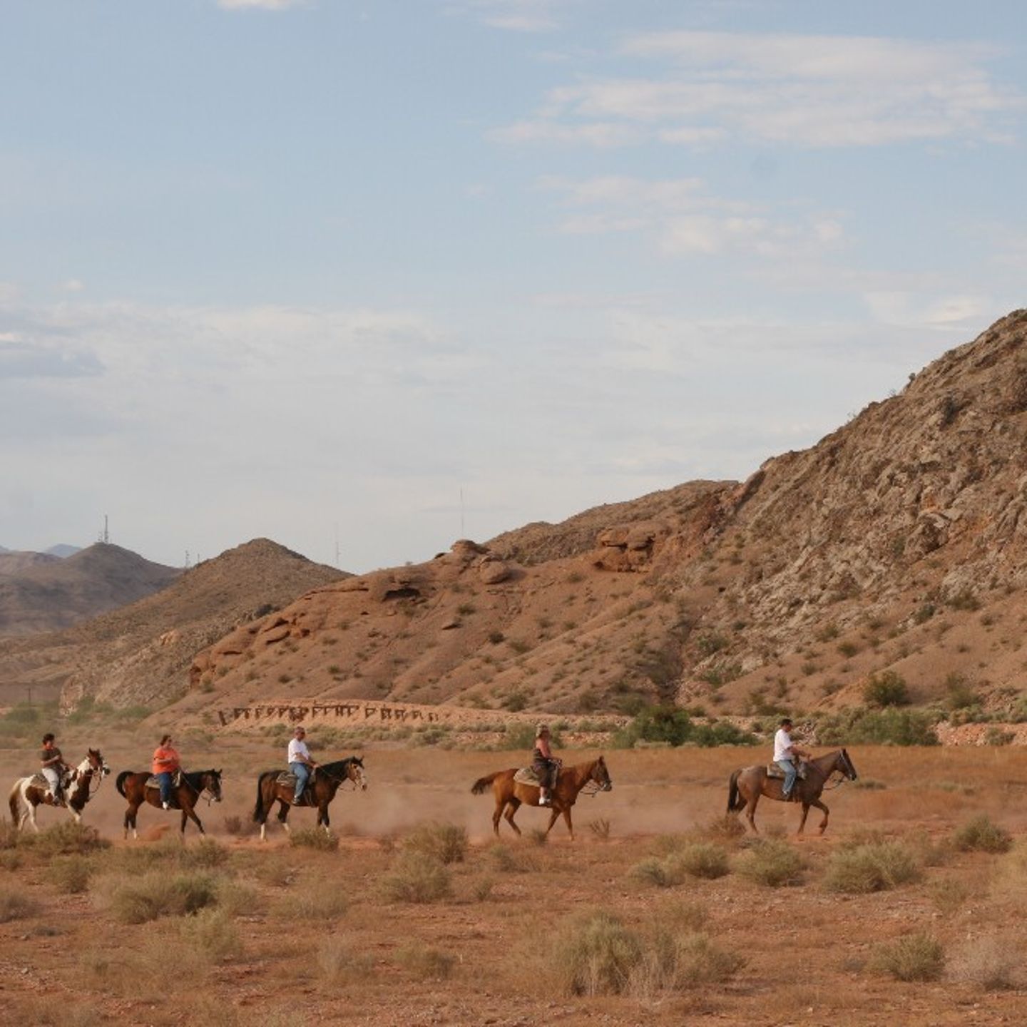 Group riding through desert