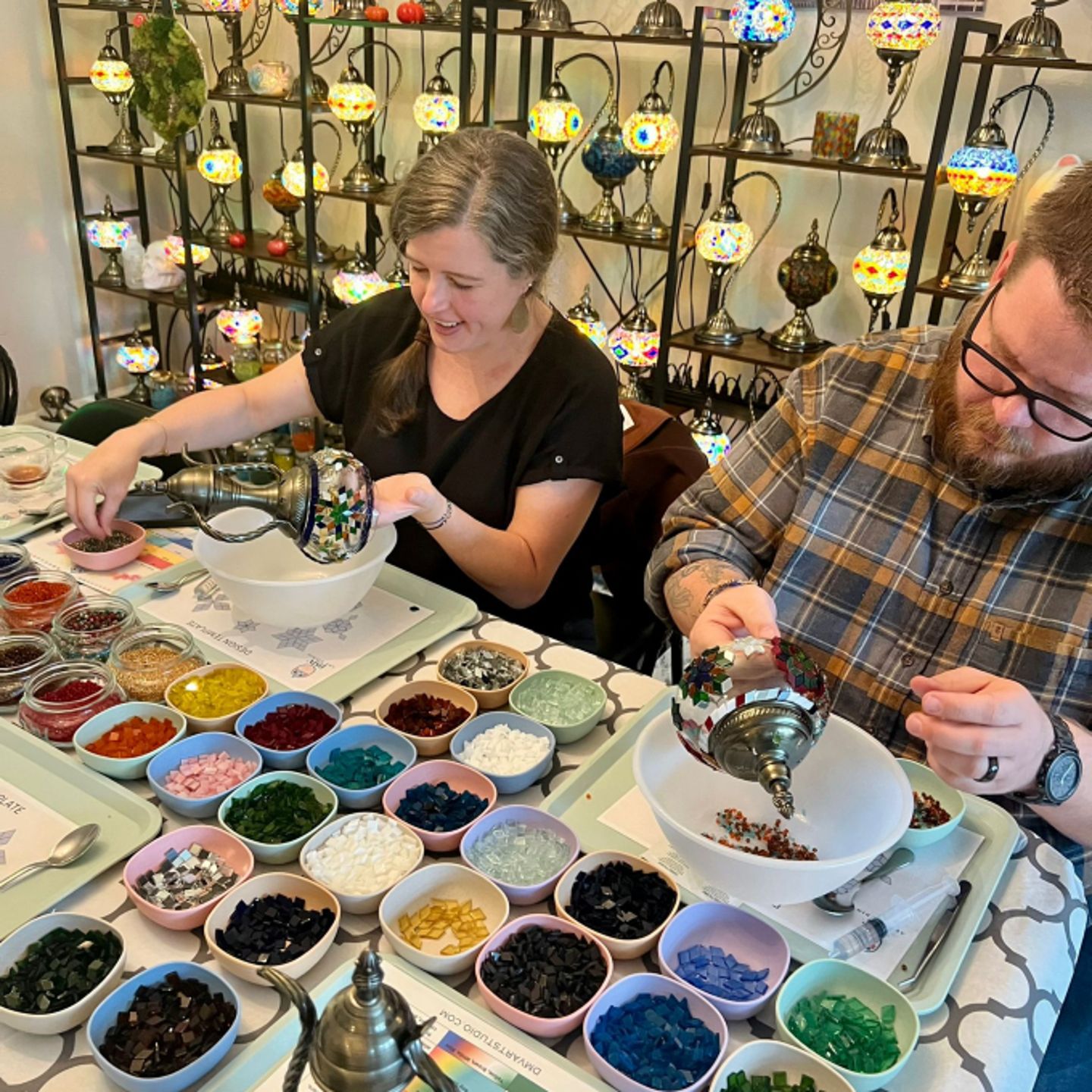 Couple working on lamps