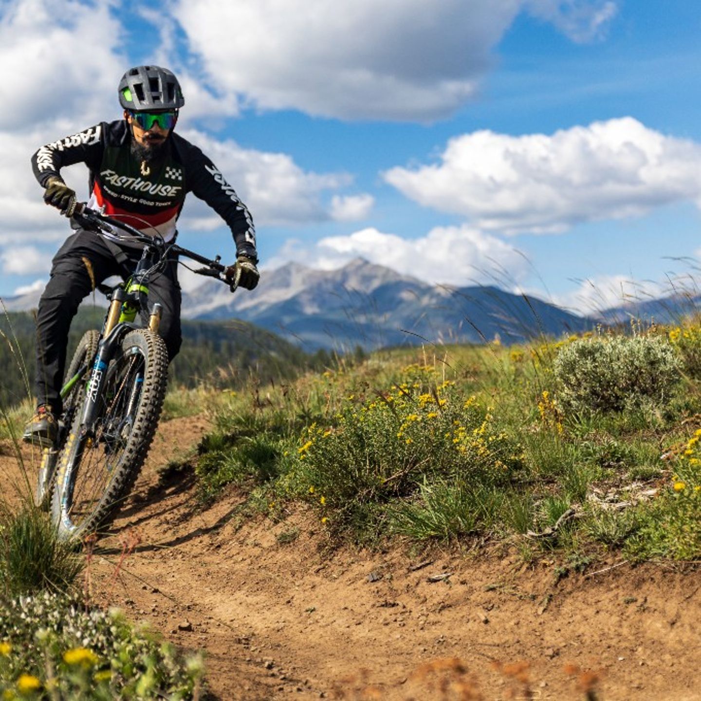 Person riding bike on trail