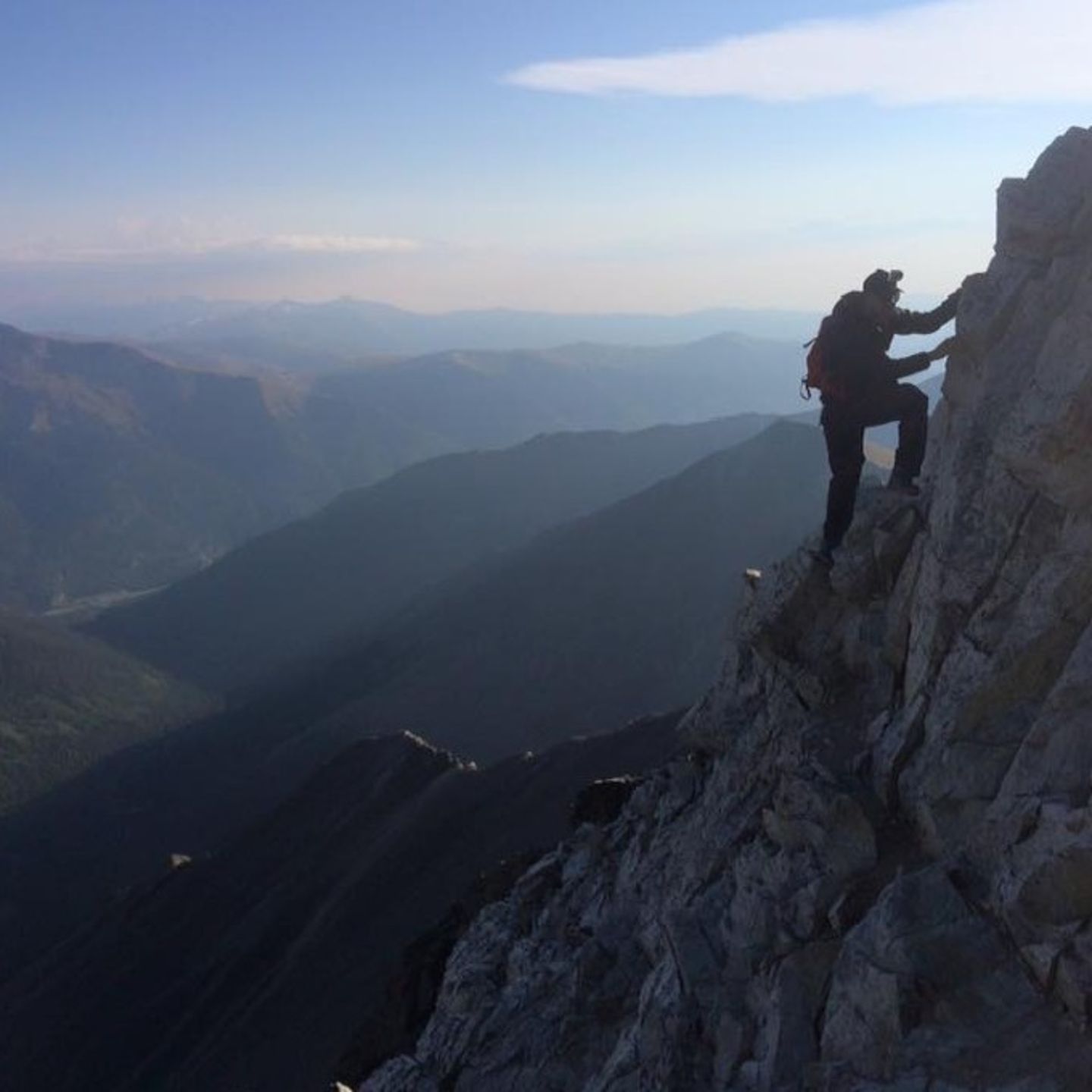 Person climbing up mountain