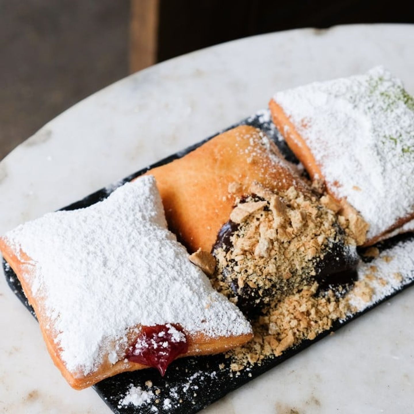 3 Beignets on a Plate with Chocolate 