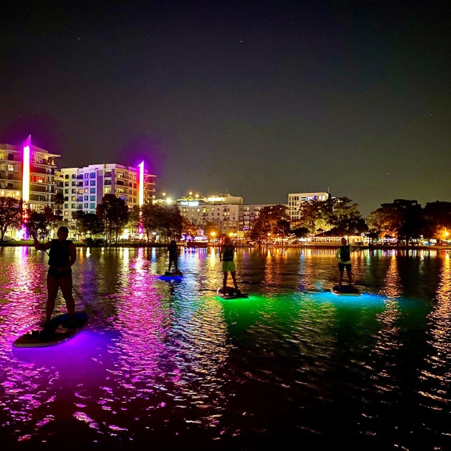 Paddleboards and city at night