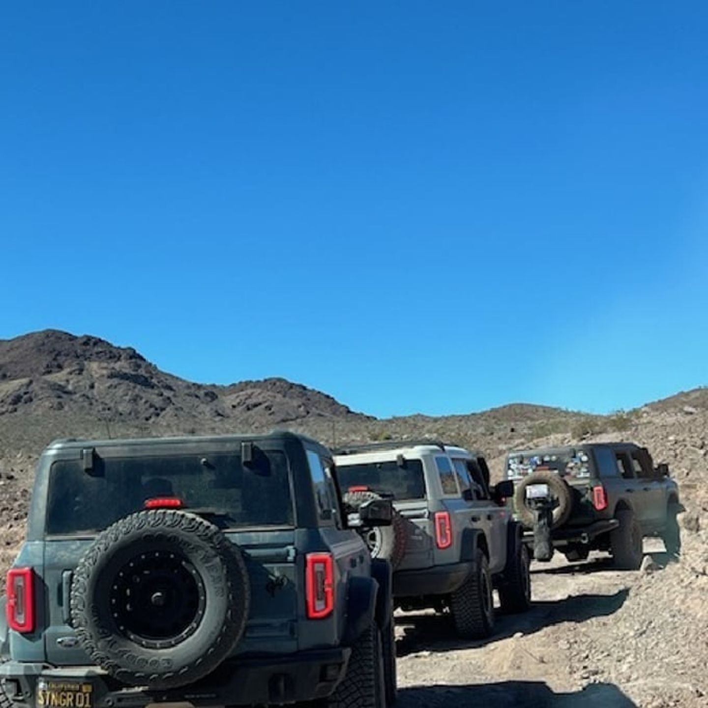 Broncos driving up hill