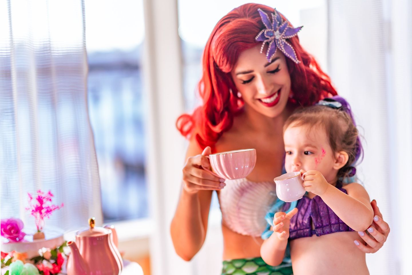 Kid and princess having tea