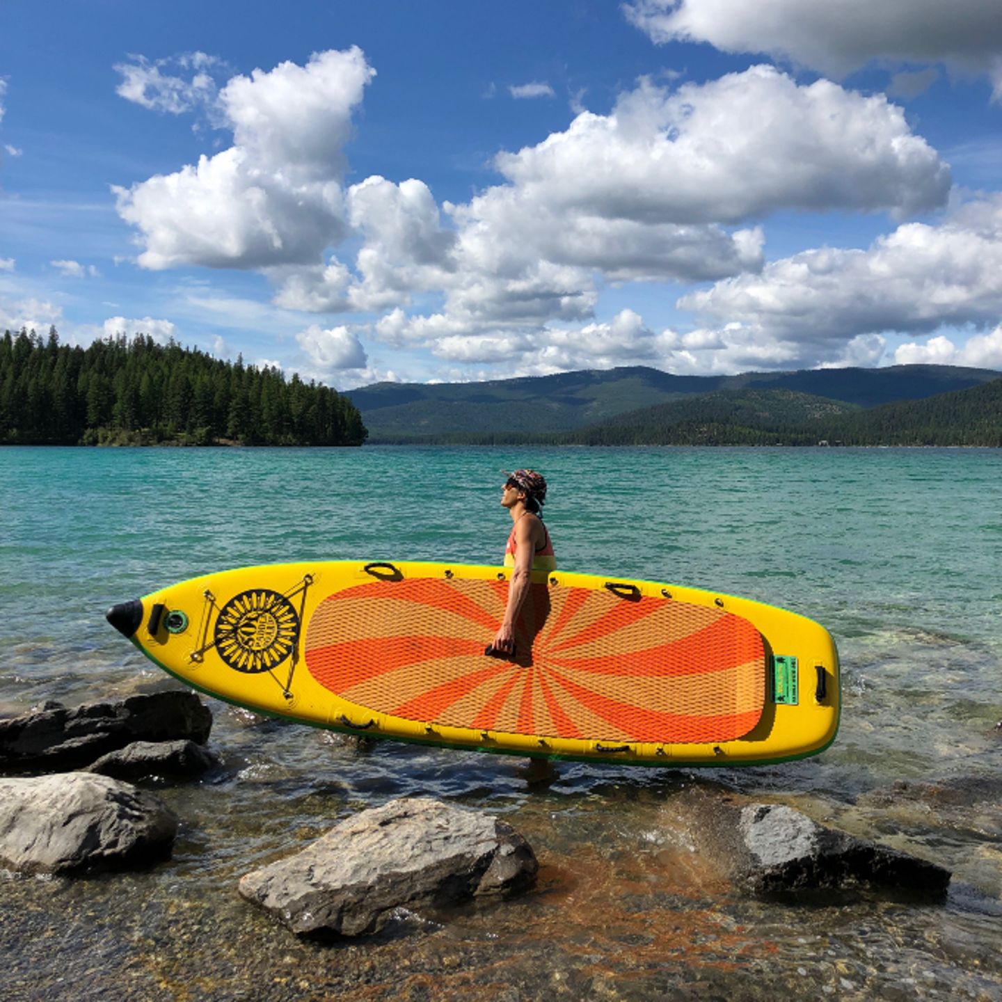 Person holding paddleboard