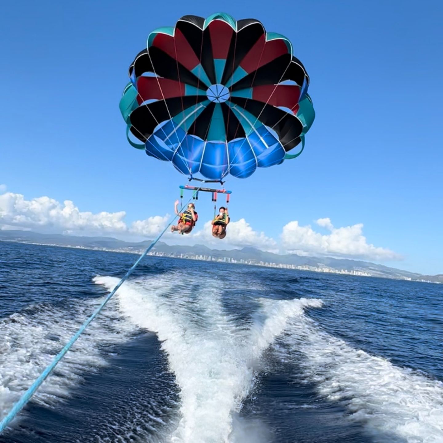 Two people parasailing