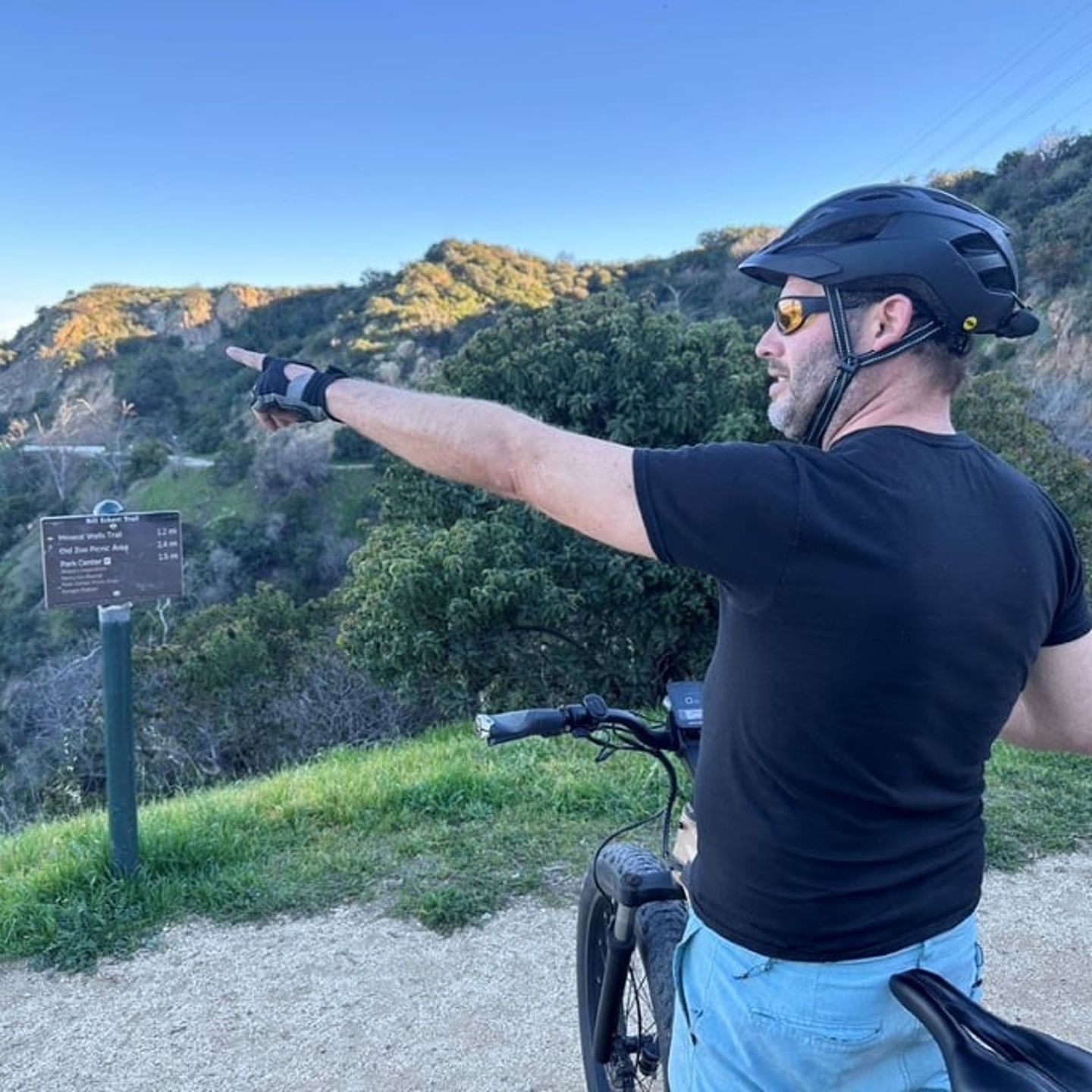 Man pointing on bike