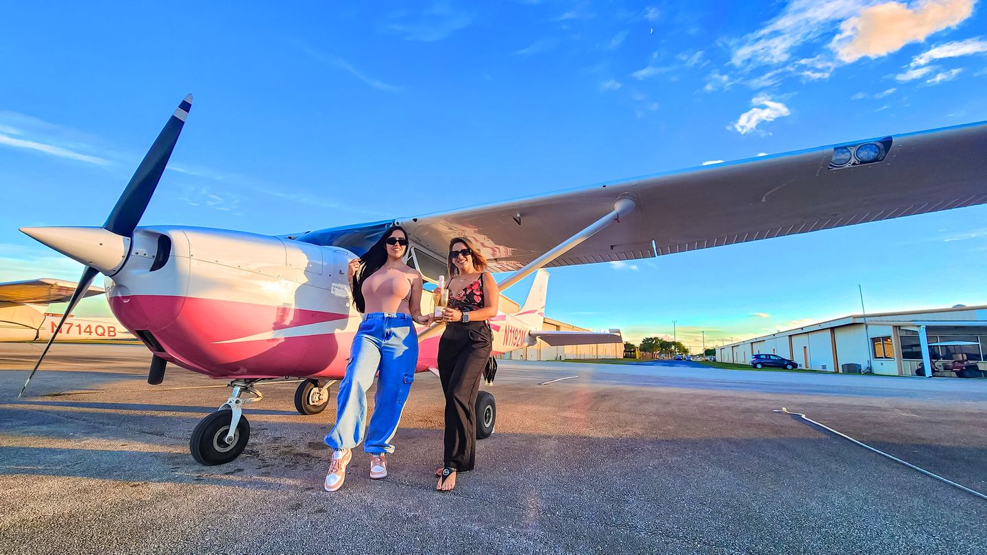 Women next to plane
