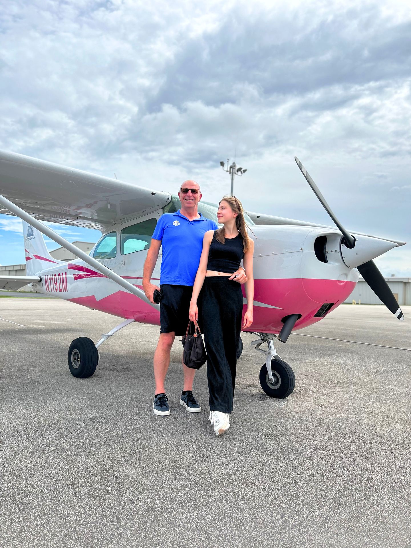 Couple next to plane