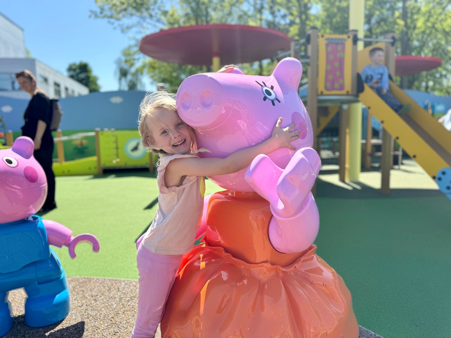 Little girl hugging Peppa