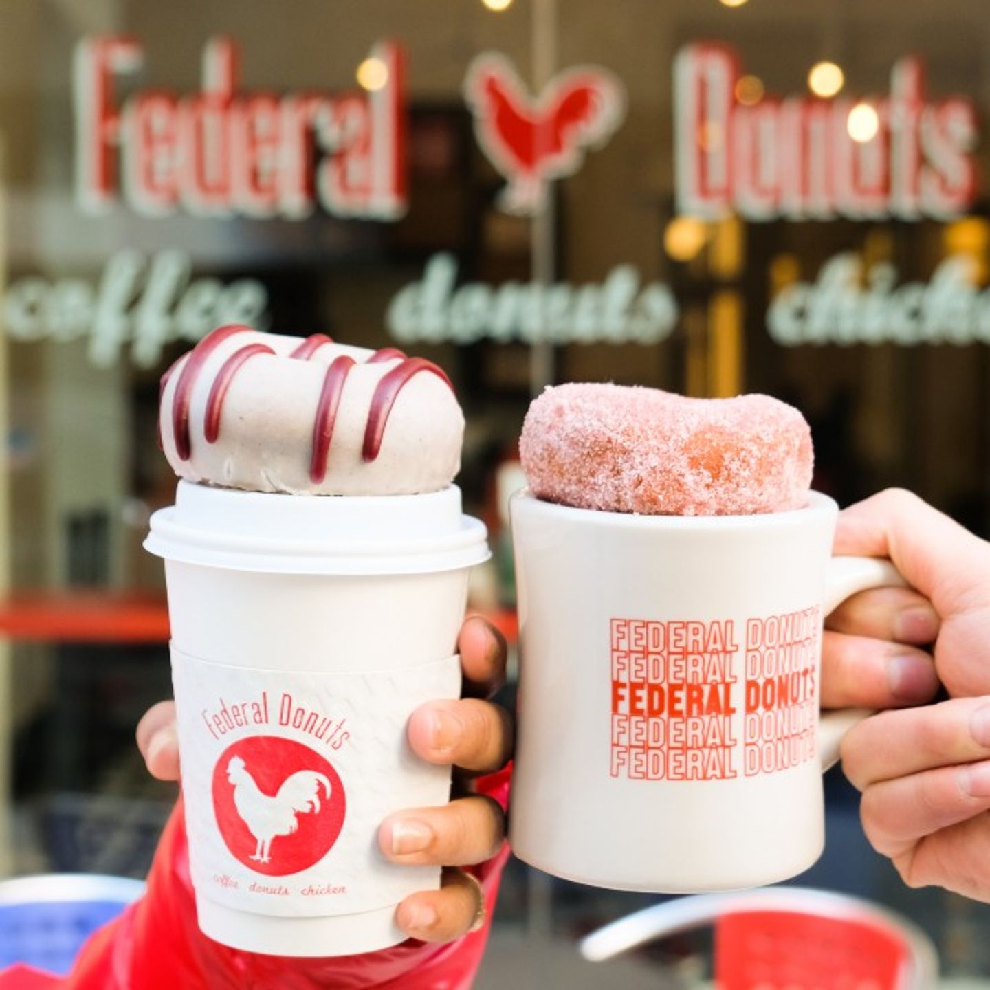 Donuts on Top of Coffee Cups
