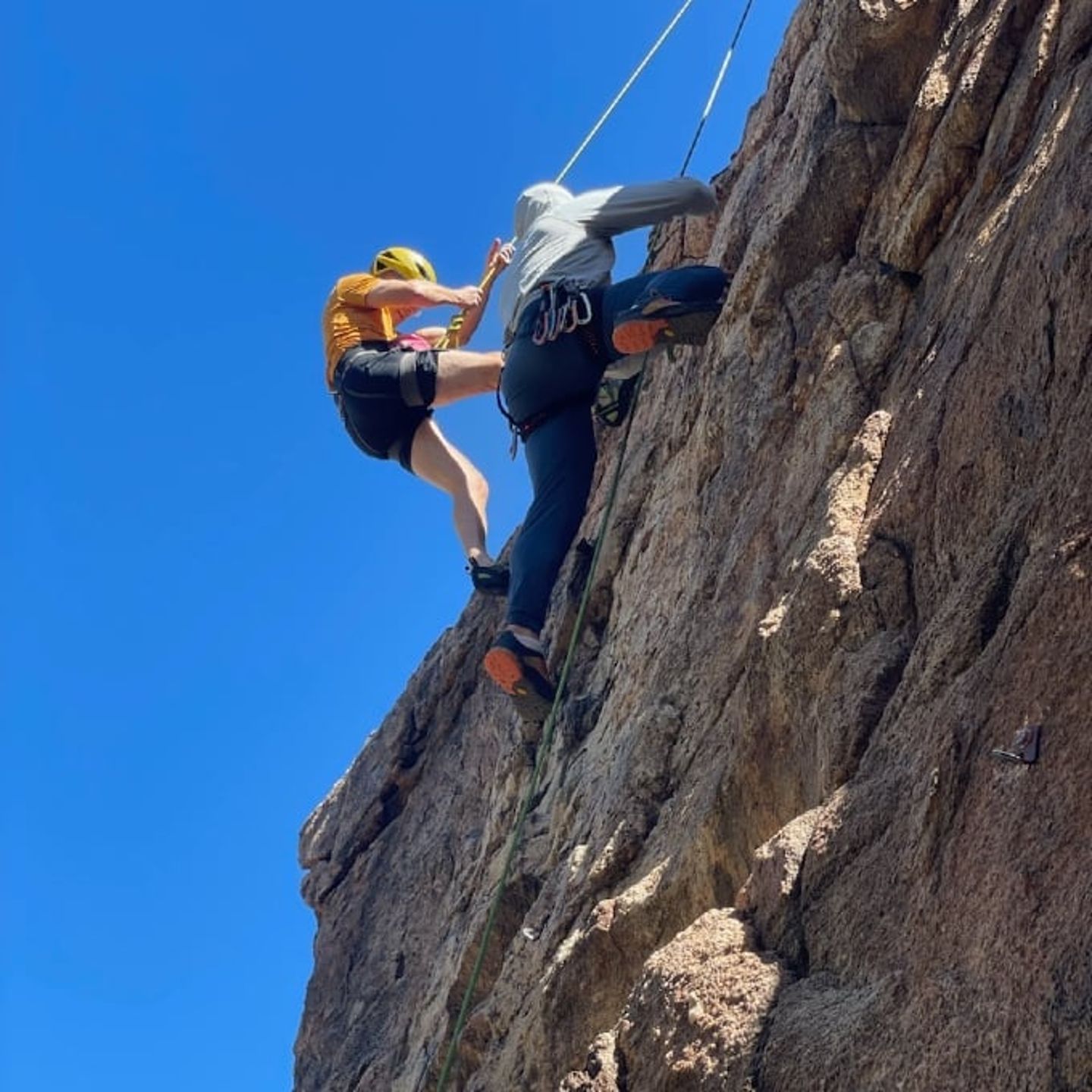 Two woman climbing