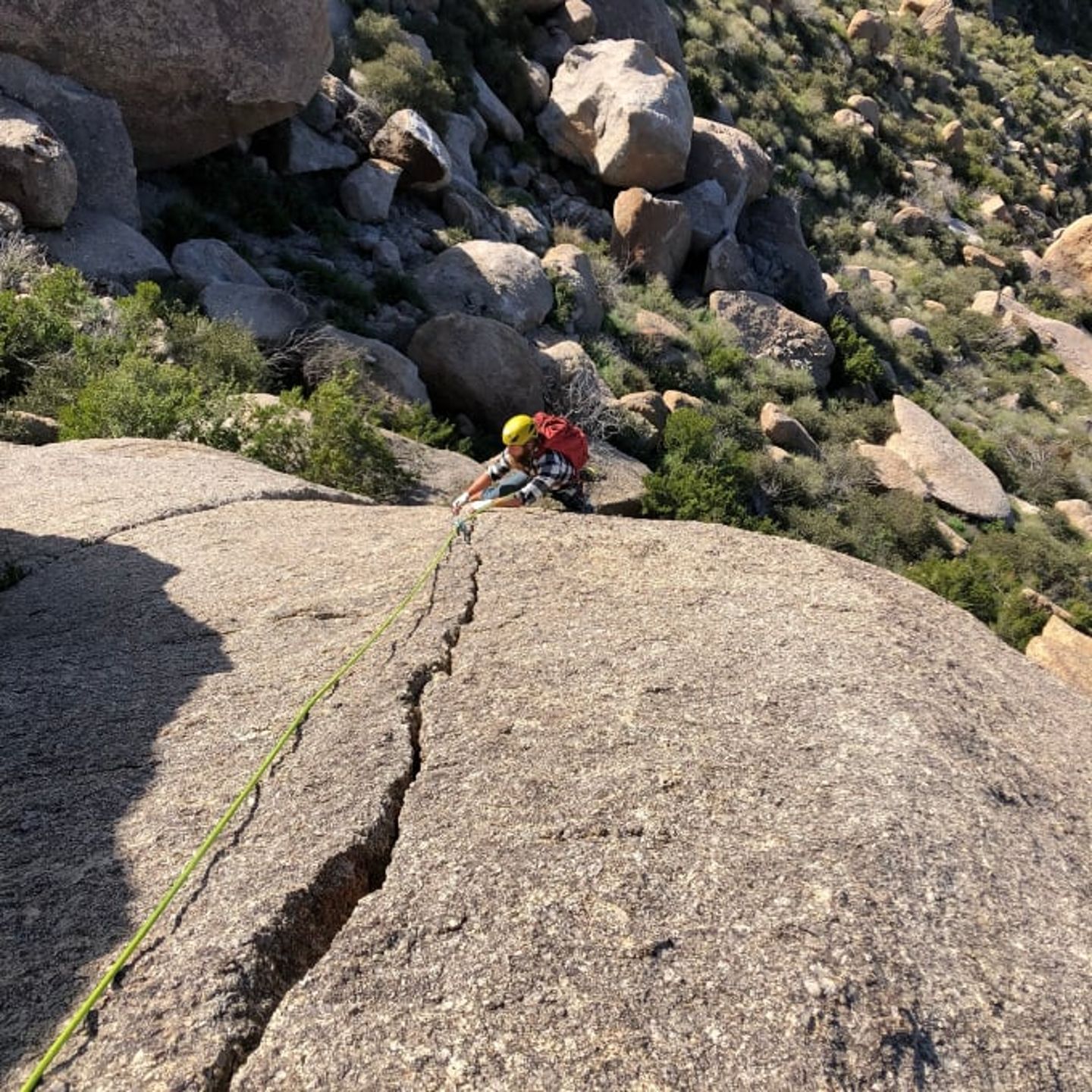 Woman climbing rock