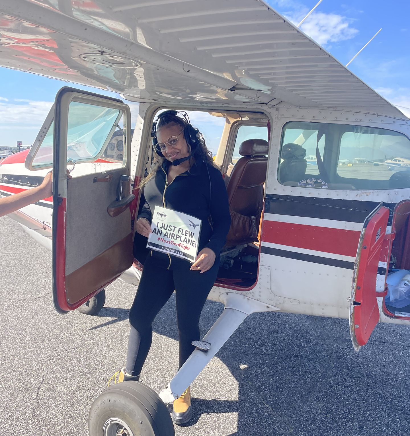 Woman next to plane