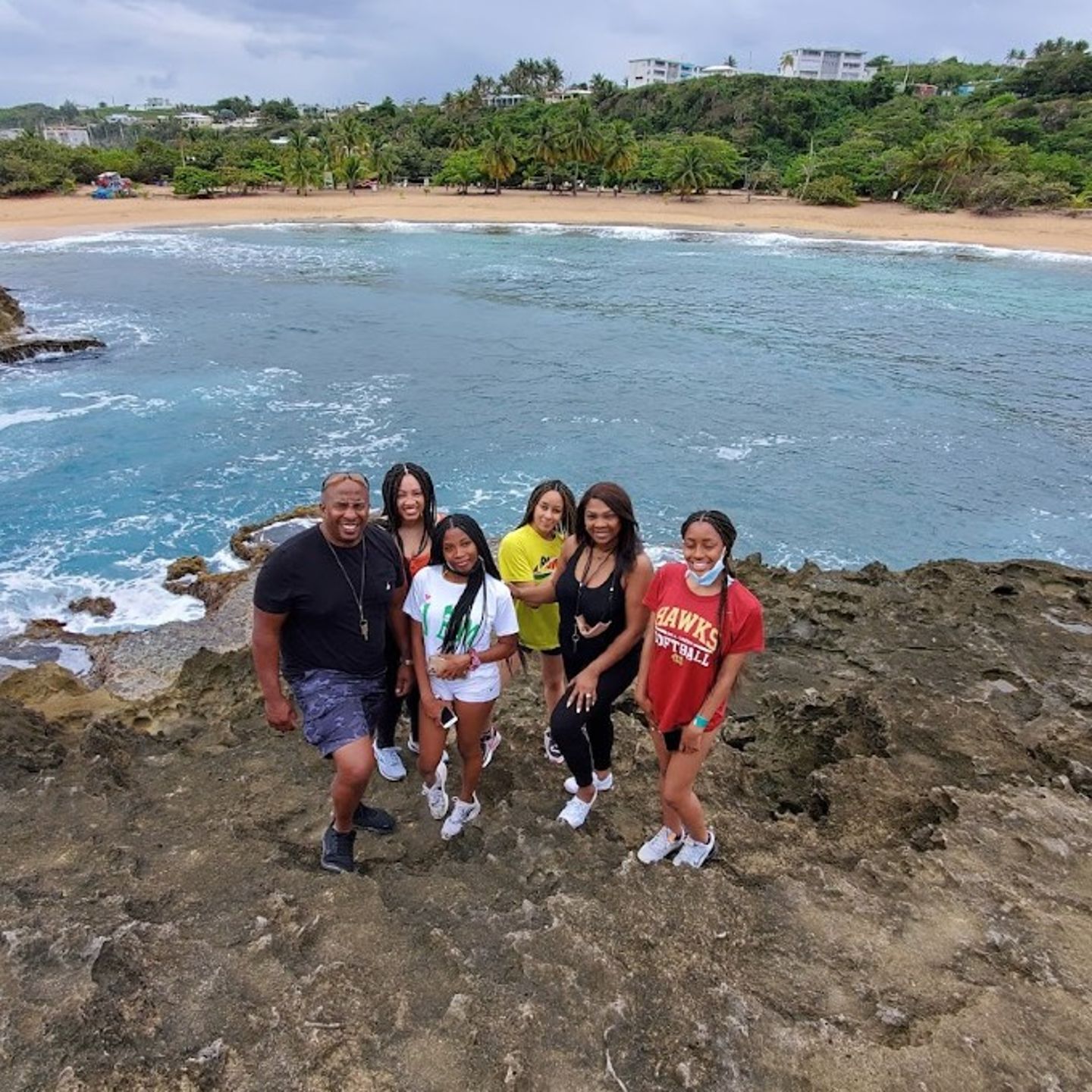 Group on Rock by Ocean