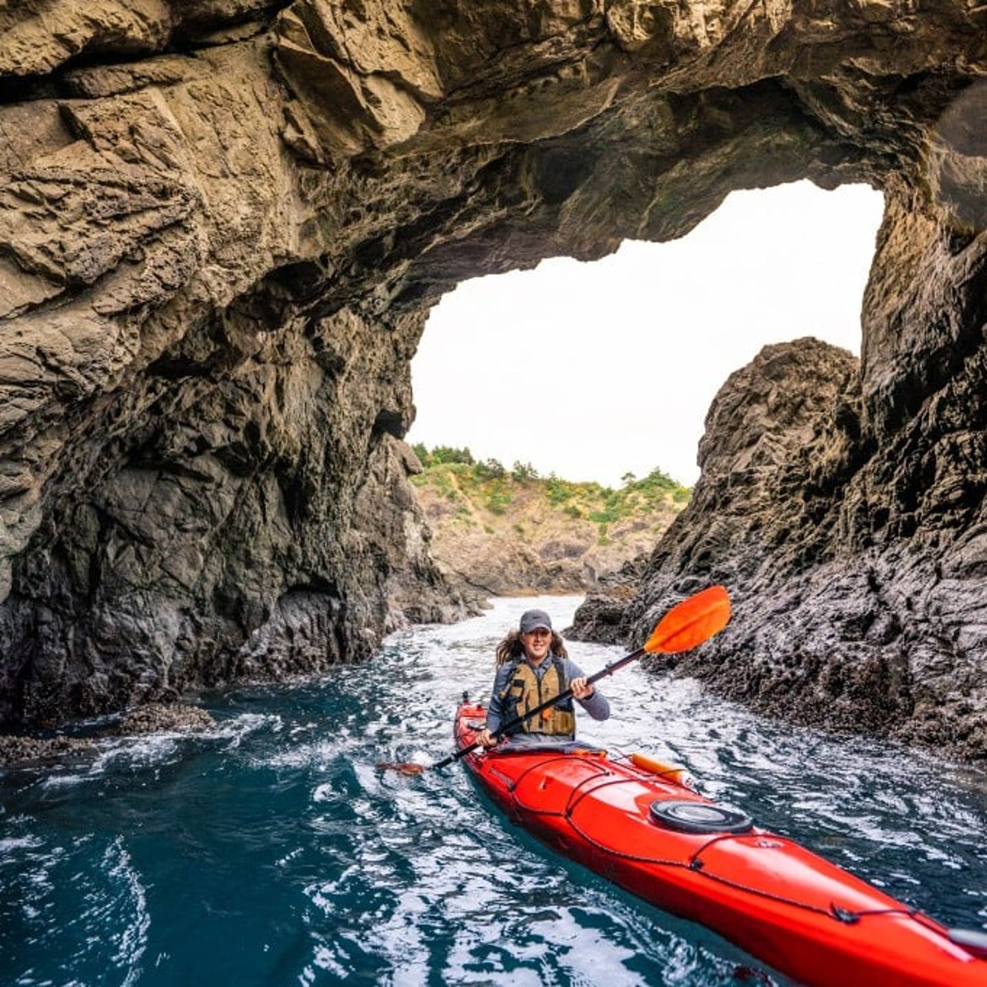 Person on kayak in arch