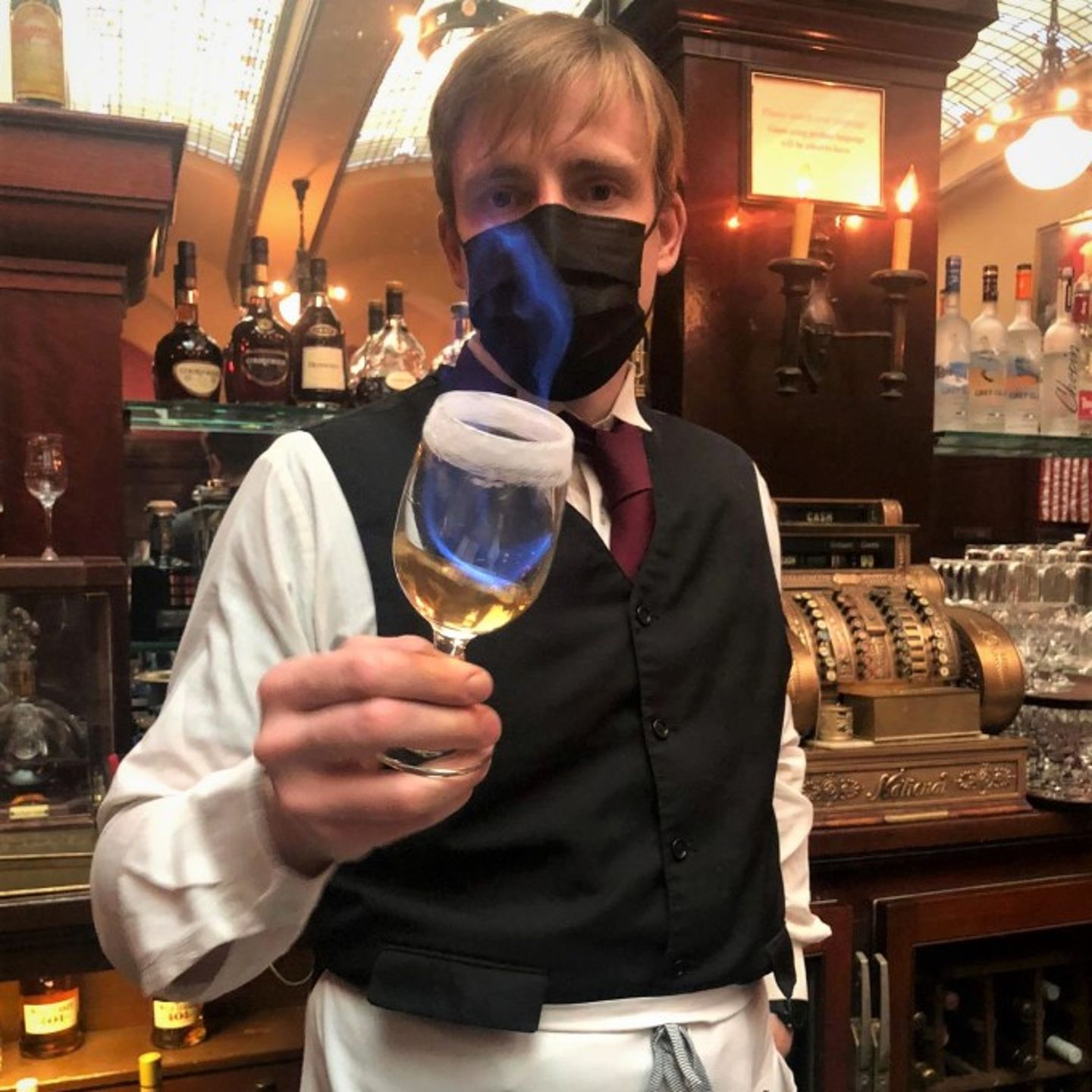 Man with drink on fire