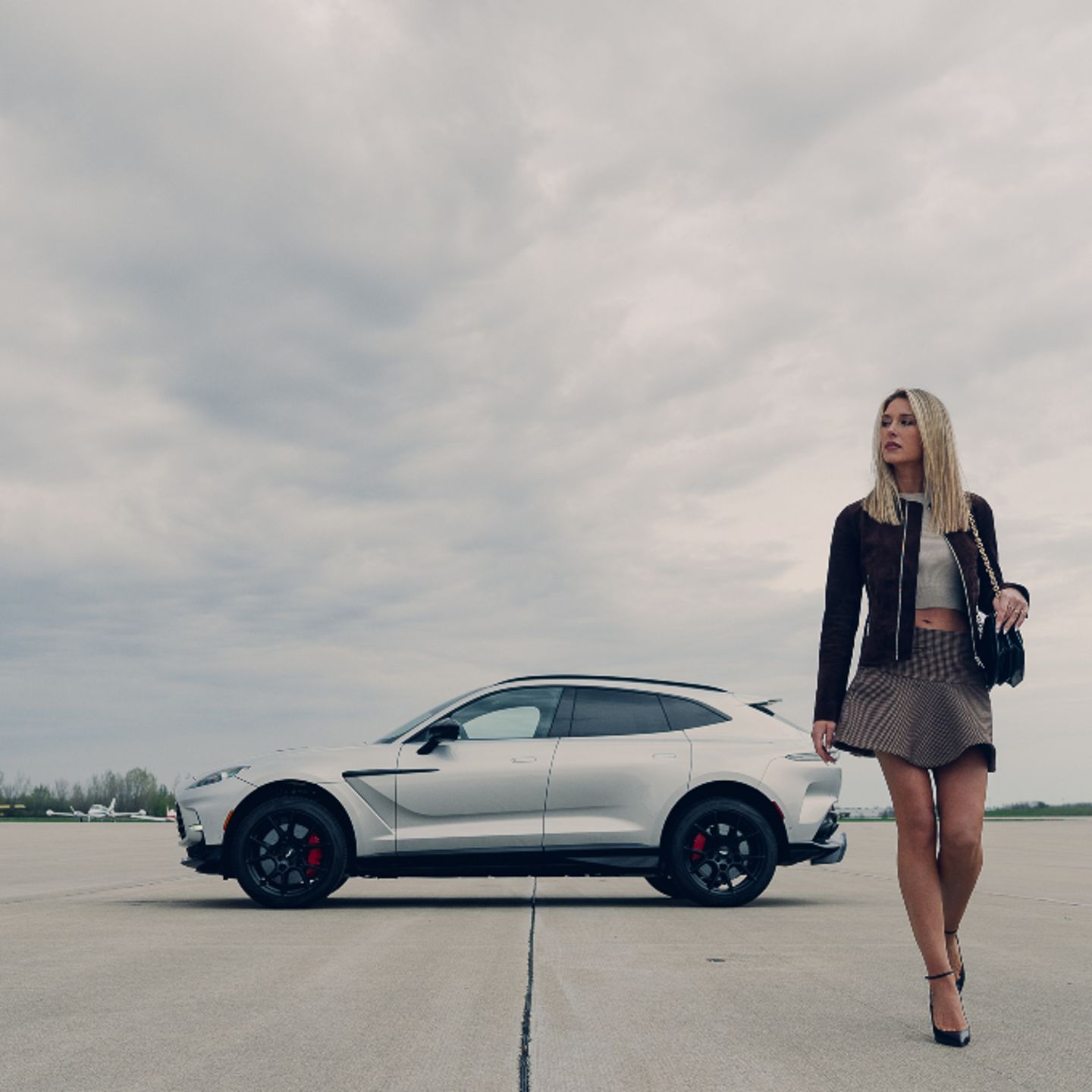Woman walking in front of car