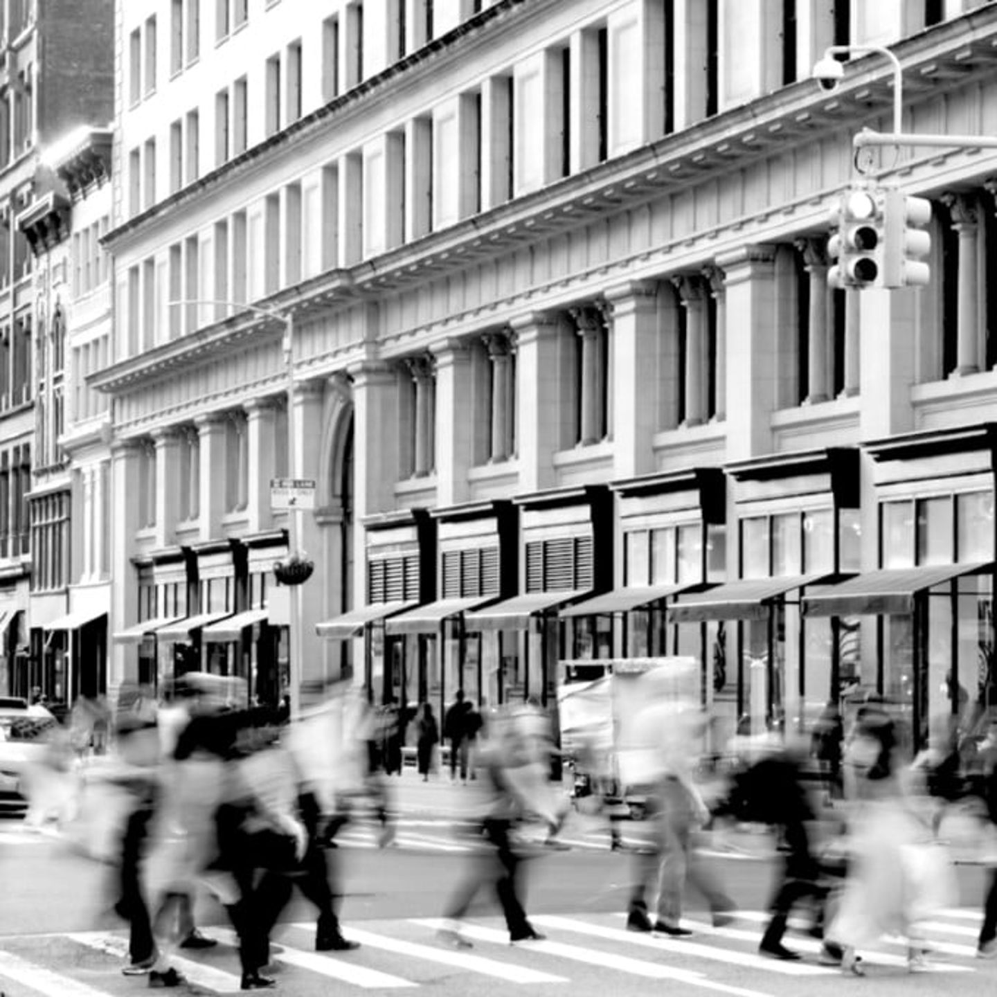 Black and White Photo of People Walking in City