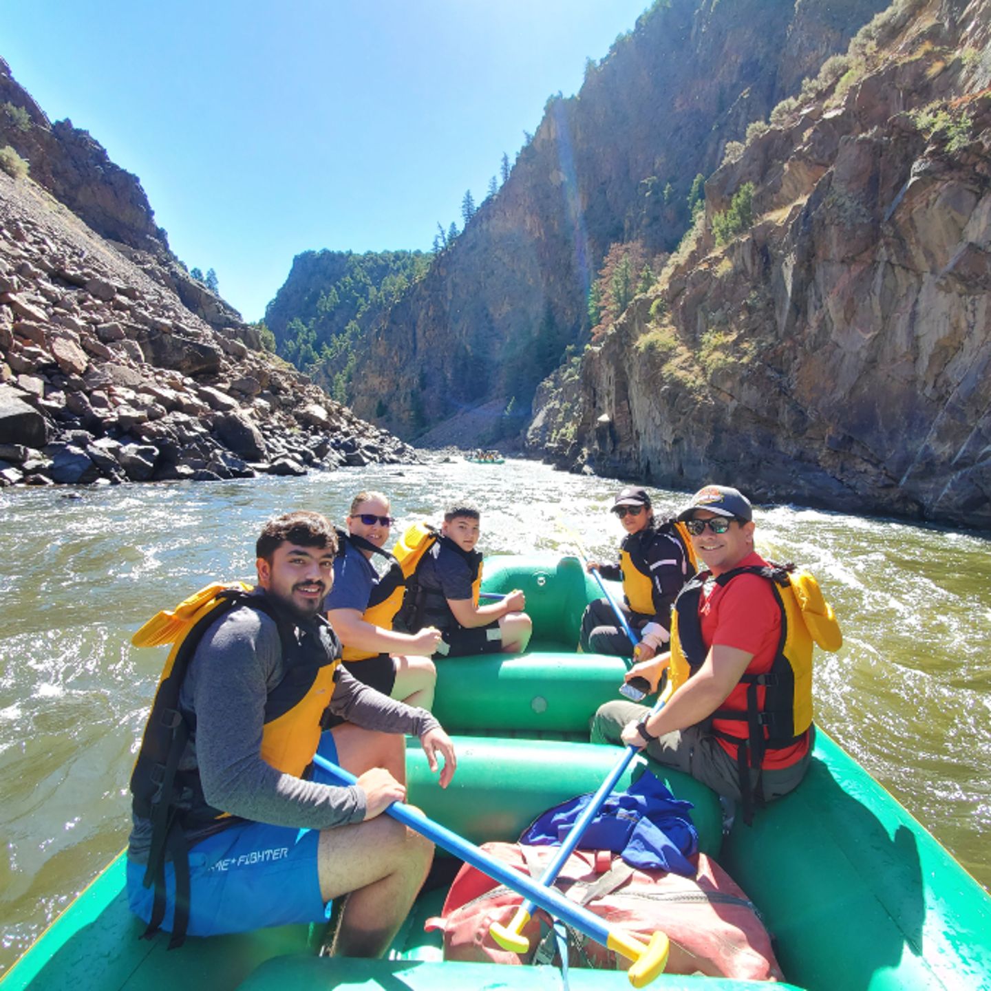 Group sitting on raft