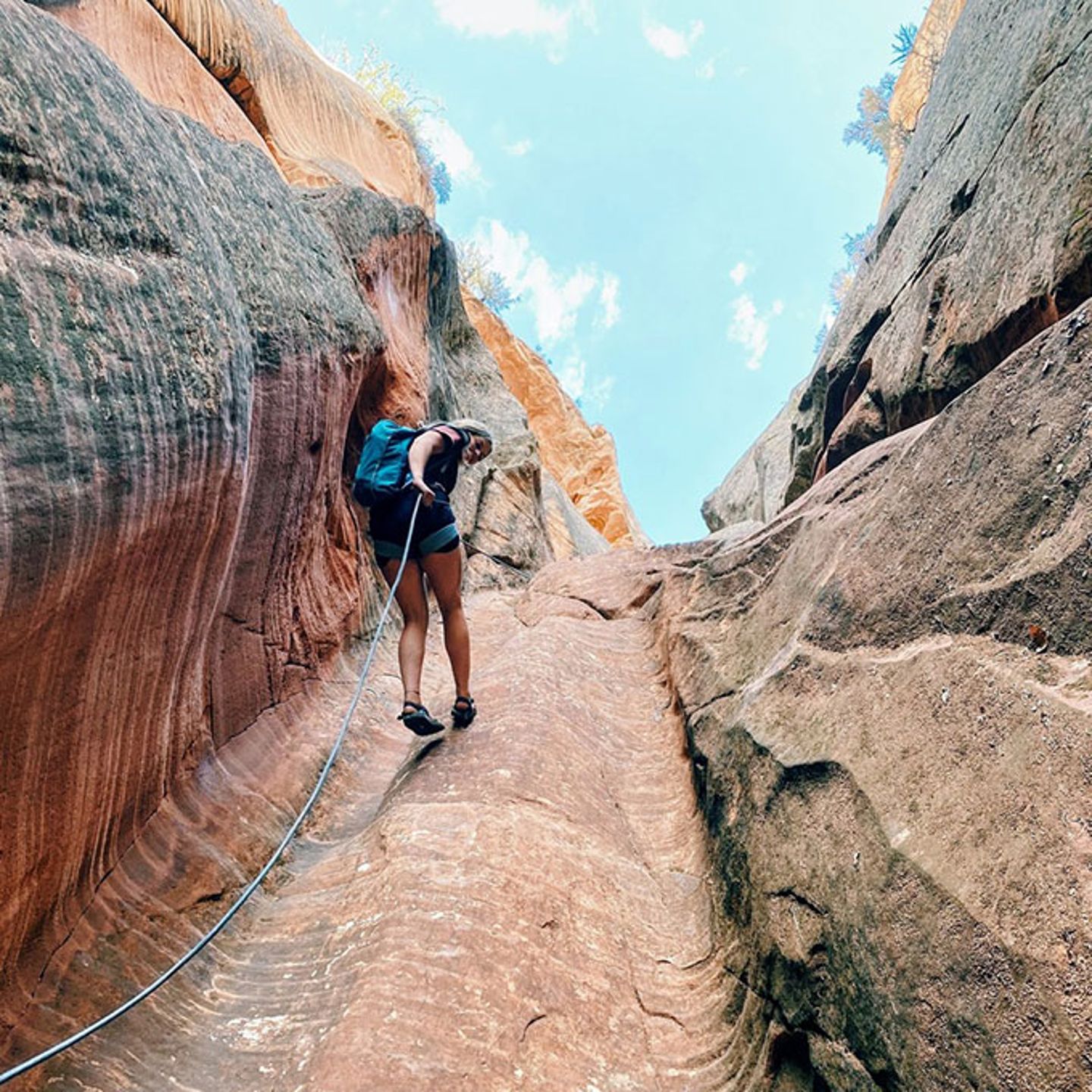 Rappelling Down Canyon Wall
