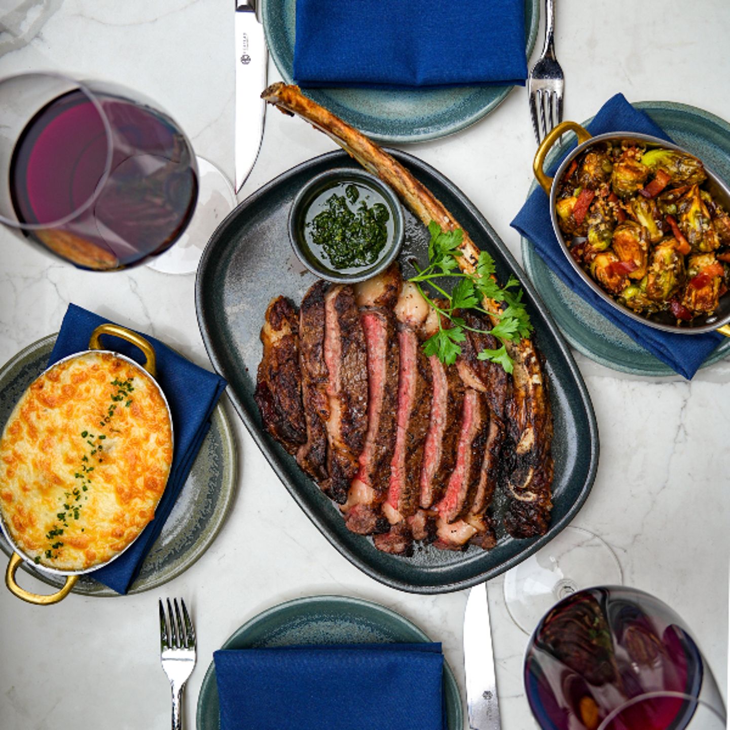 Tomahawk steak with sides