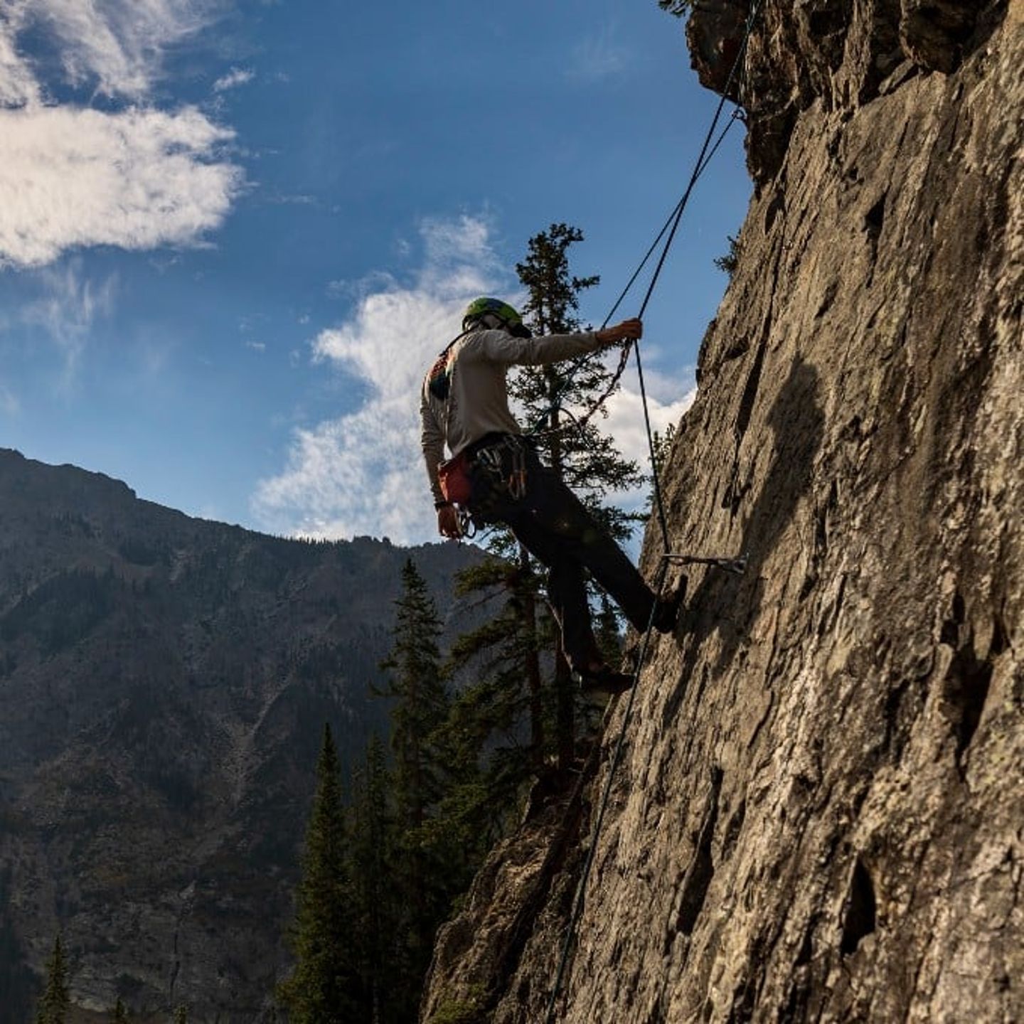 Person climbing up rock