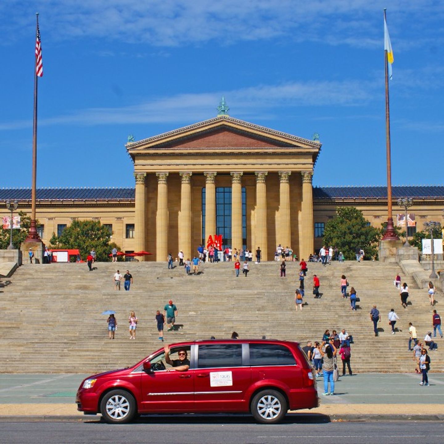 Tour Van in Front of Building 
