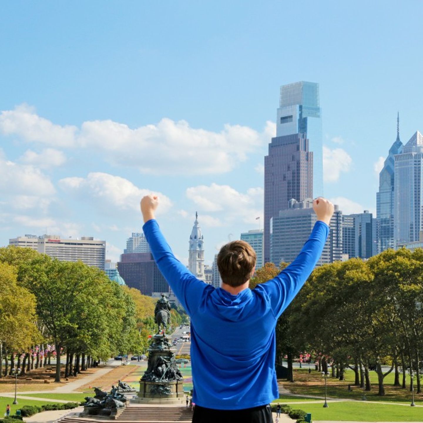 Man Posing in Front of City