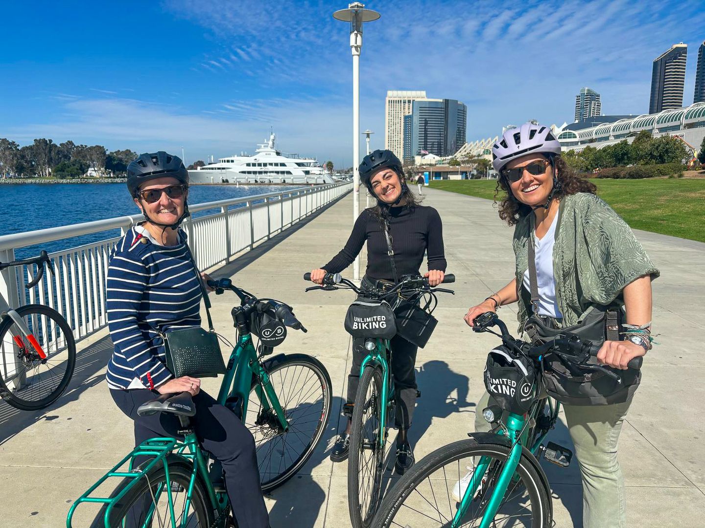 Bikers smiling by the ocean