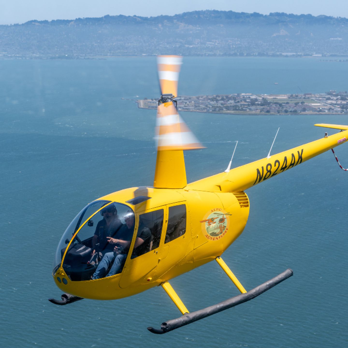 People flying in helicopter