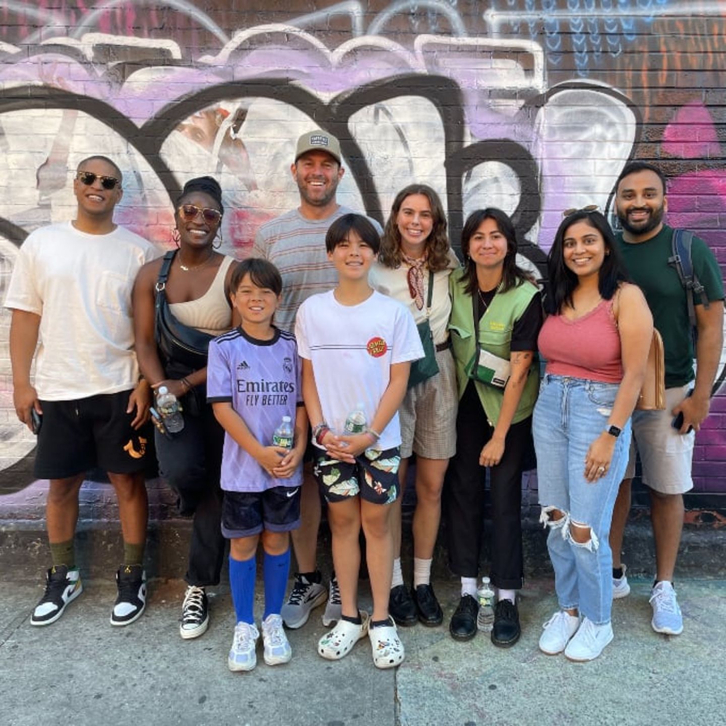 Group in front of art wall