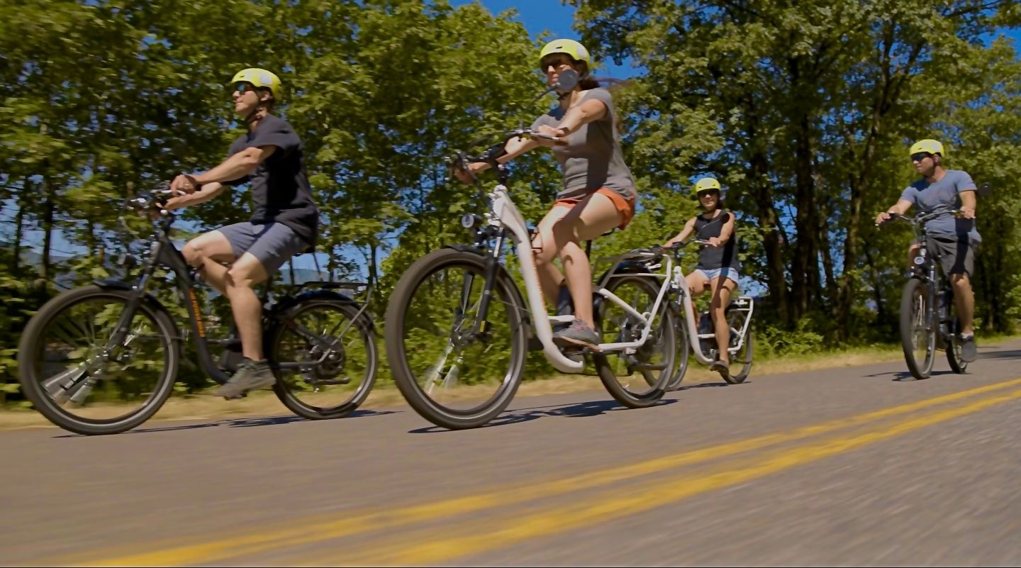 Group riding bikes on street