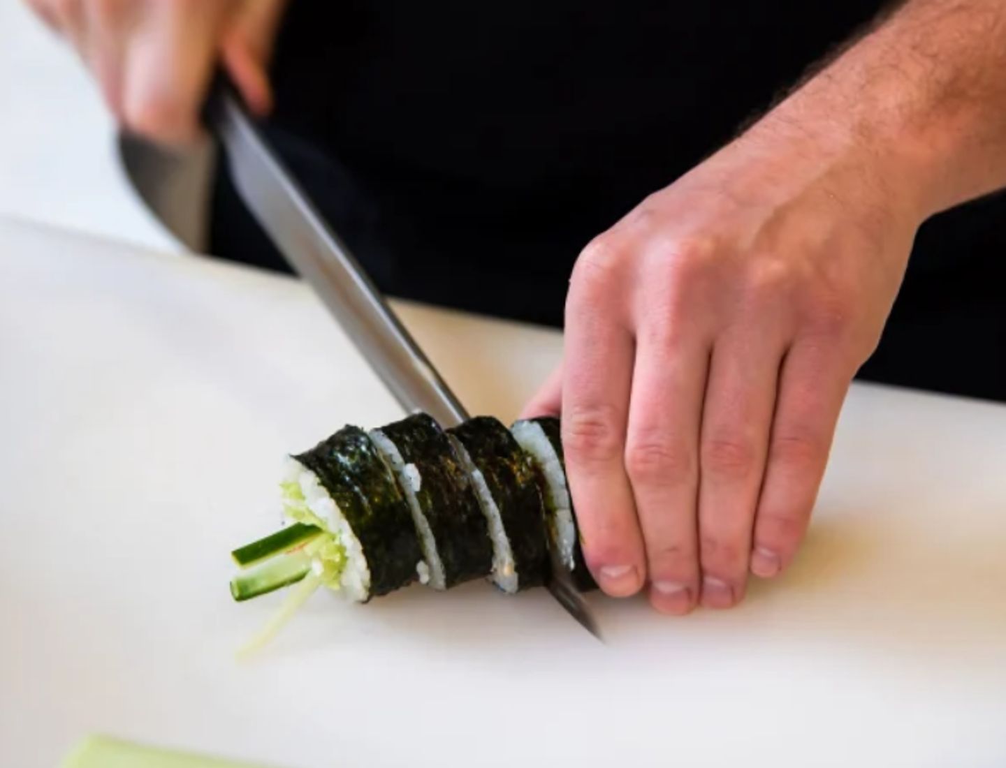 Sushi being cut