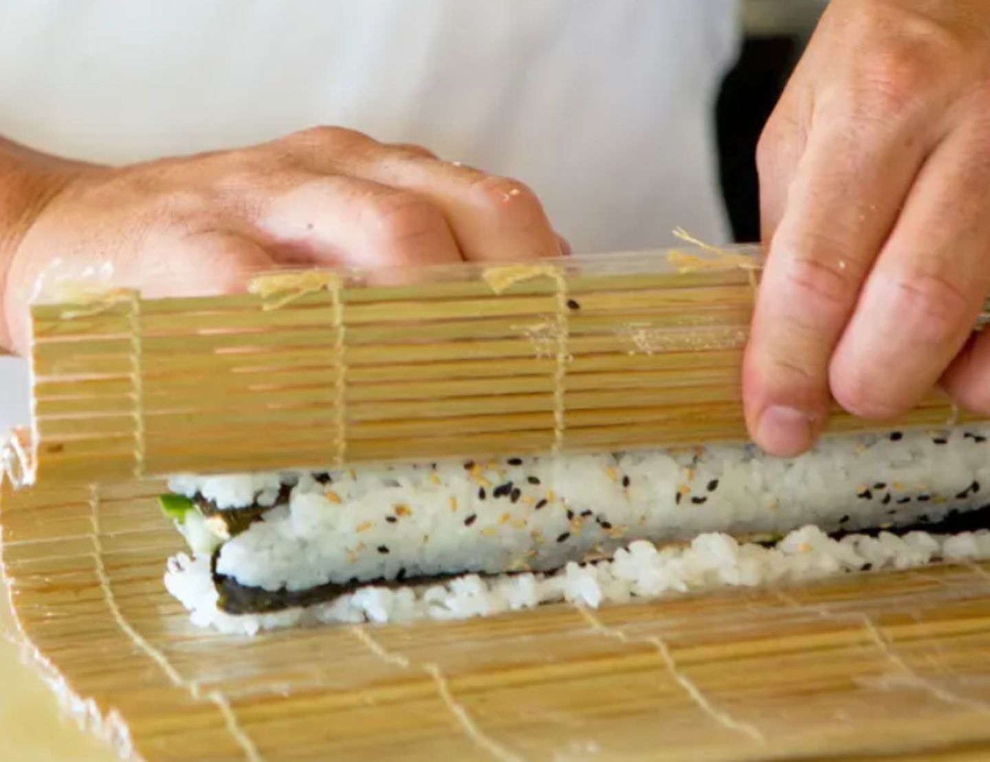 Sushi being rolled