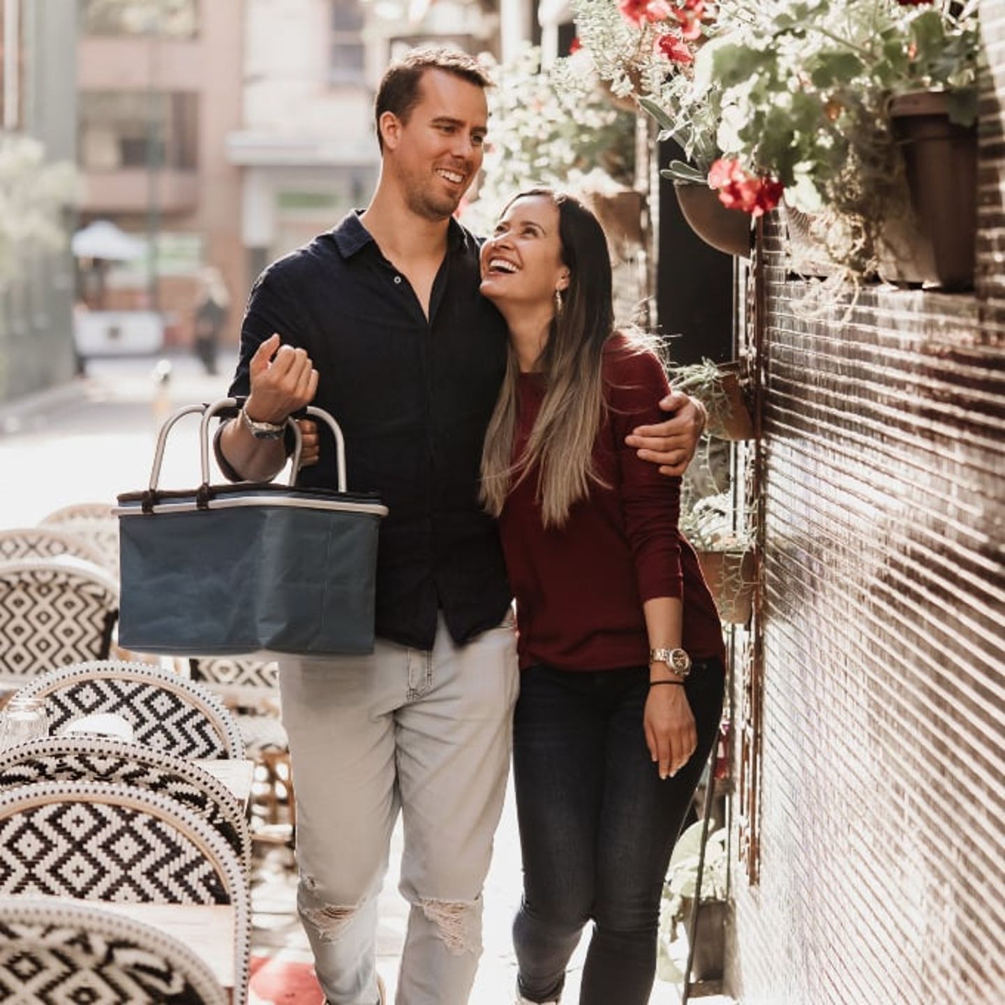 Couple walking with picnic basket