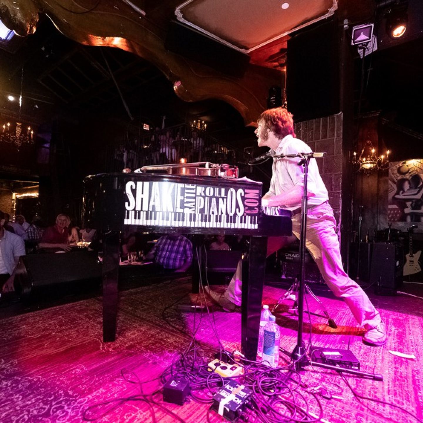 Man playing the piano on stage