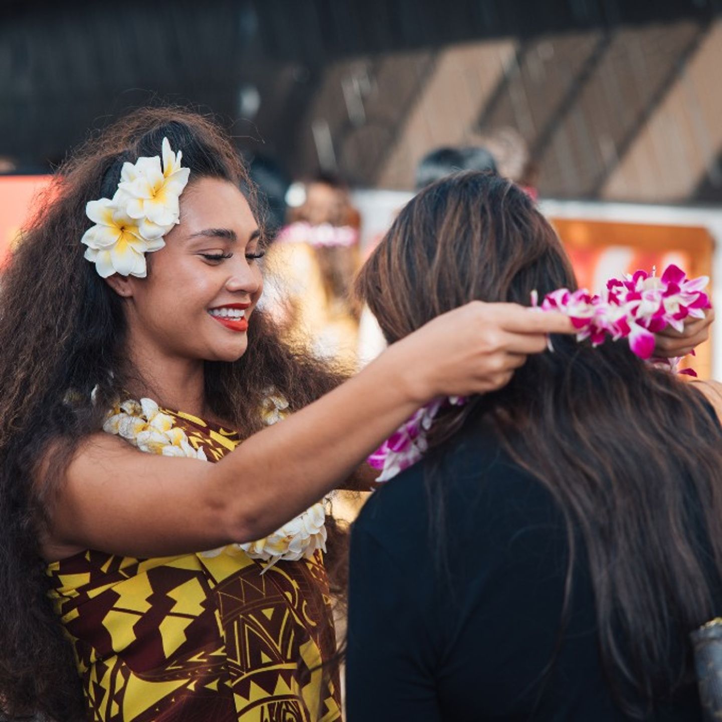 Woman giving lei