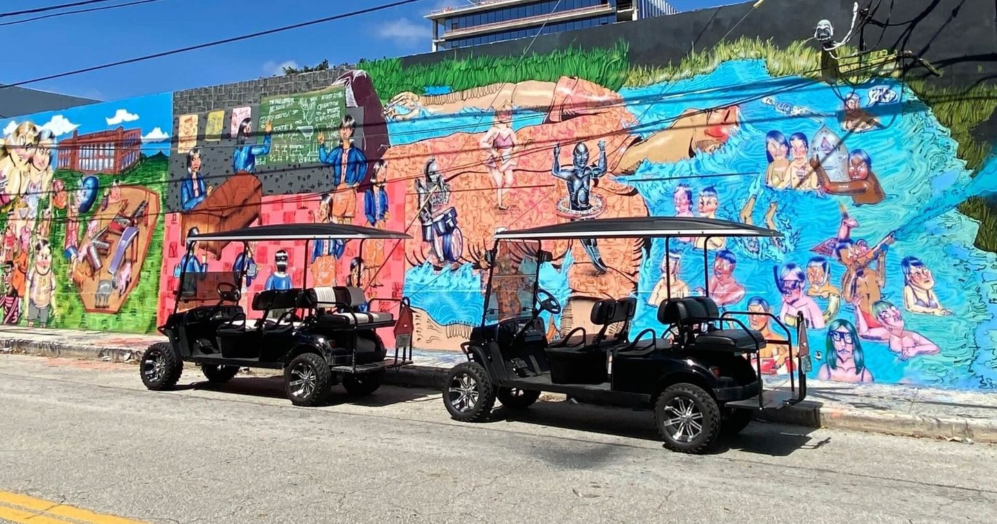 Two golf carts with art