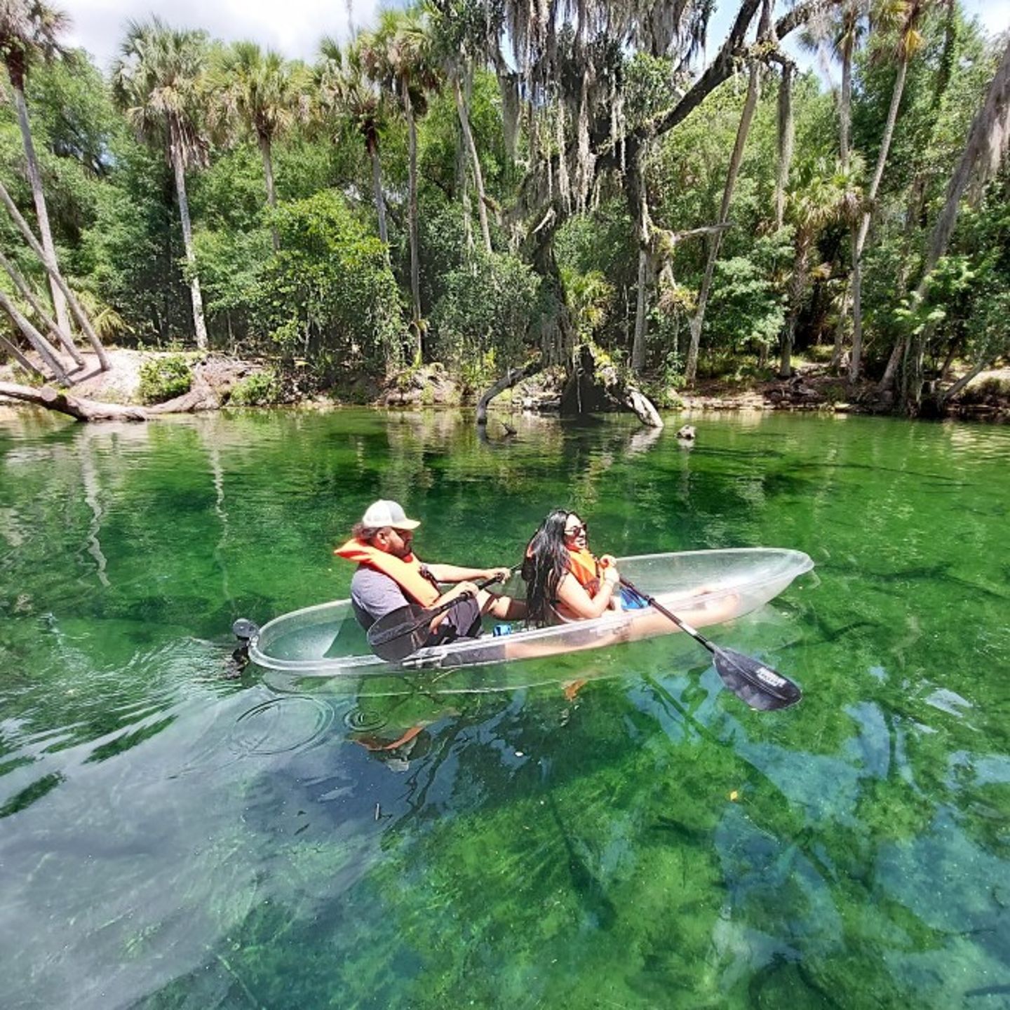 Two people on clear kayak