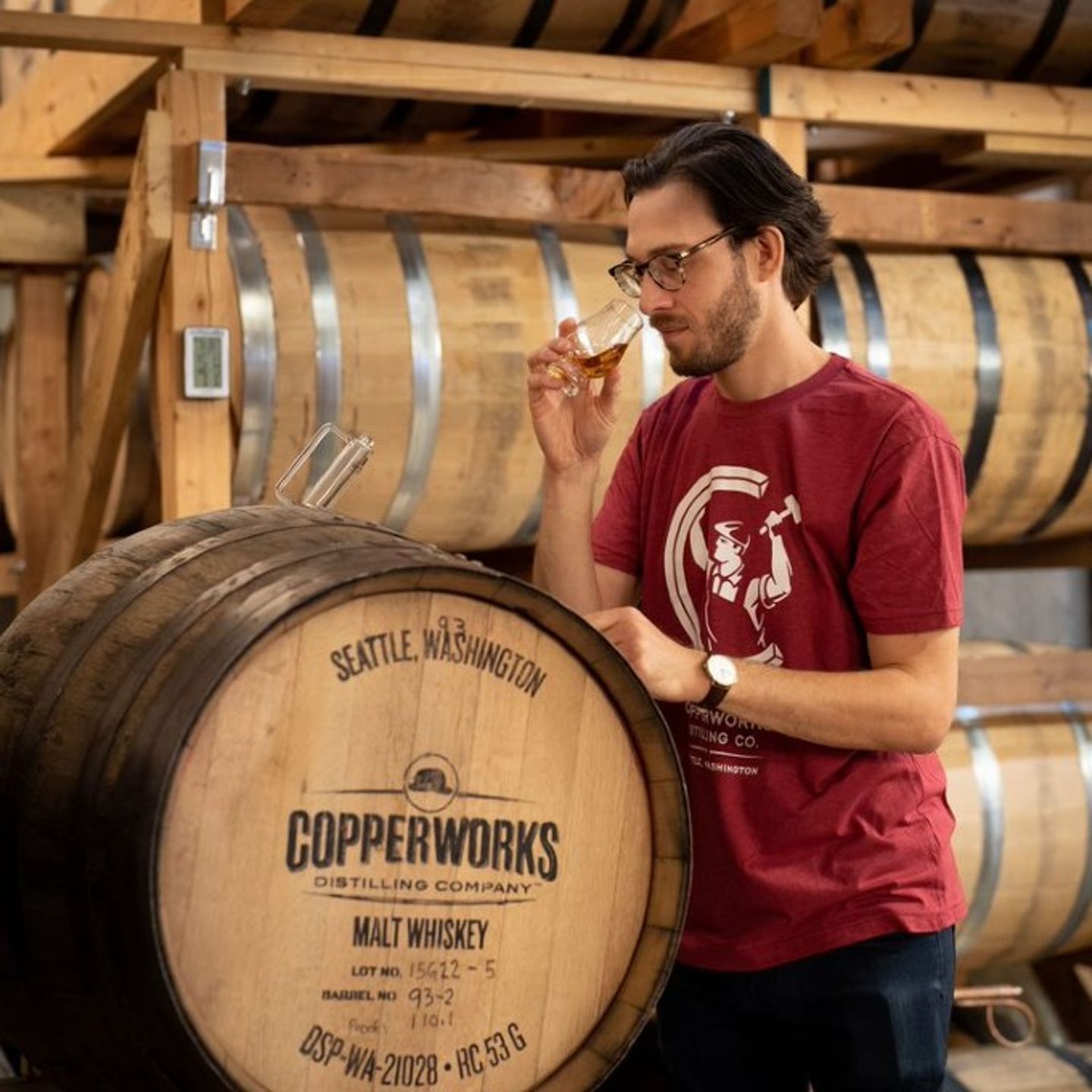 Person sampling whiskey
