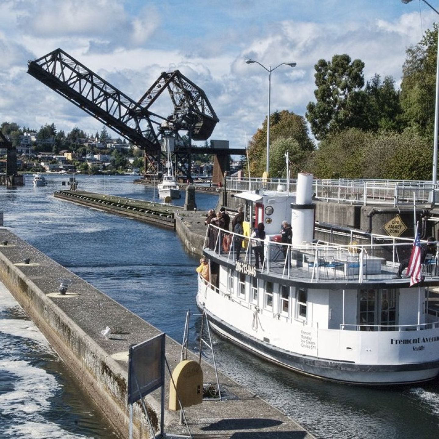 Boat going under bridge