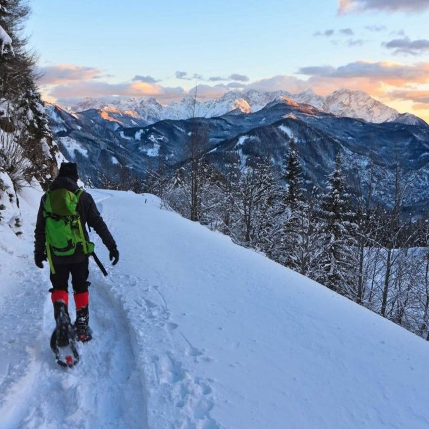Person snowshoeing through mountains