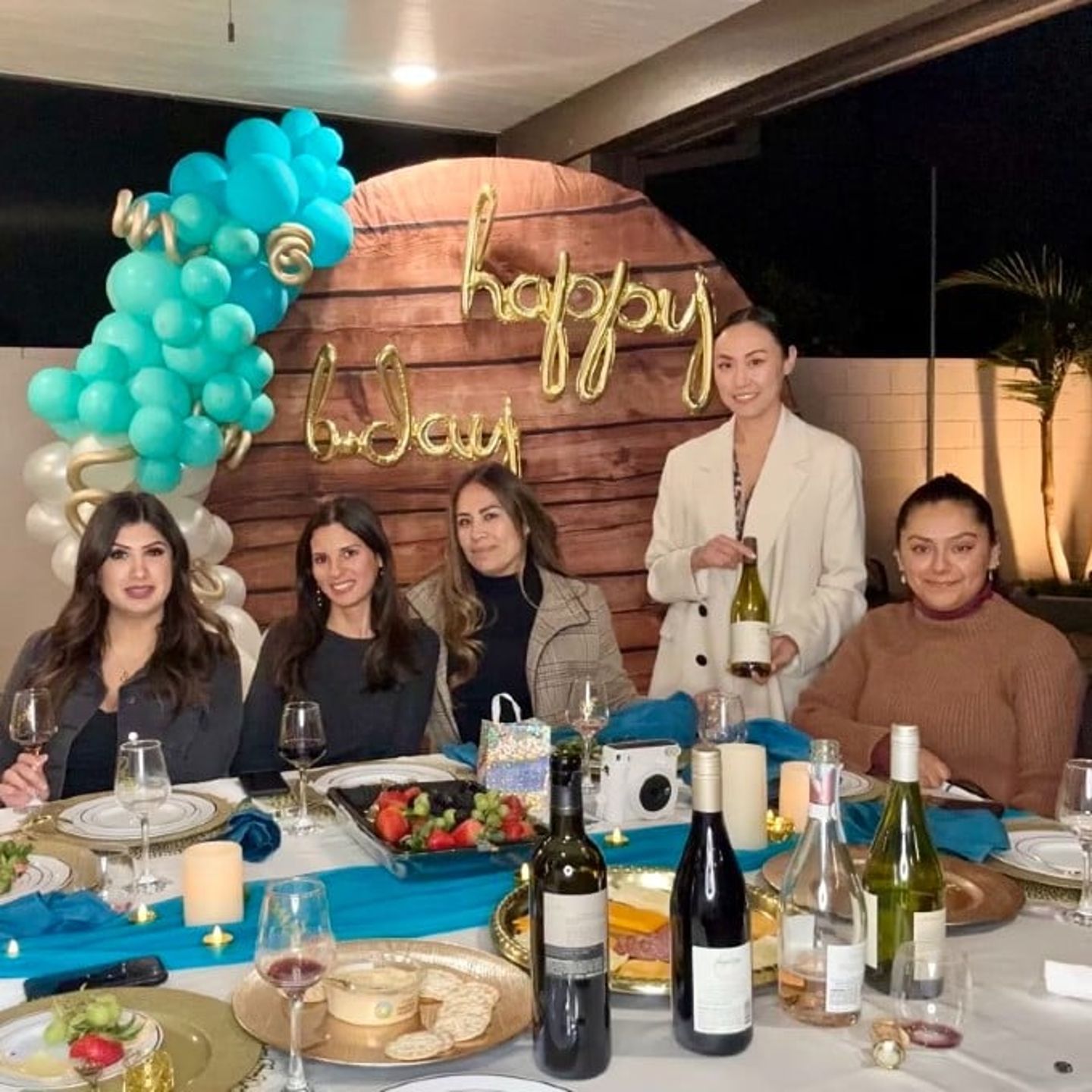 Group celebrating birthday in home