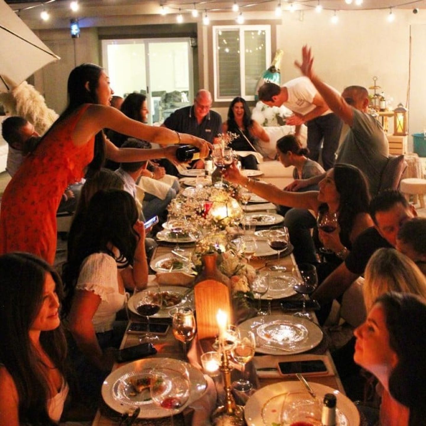 Group enjoying dinner with wine