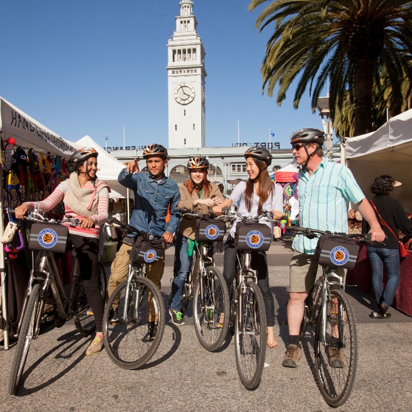 Group on bikes at market