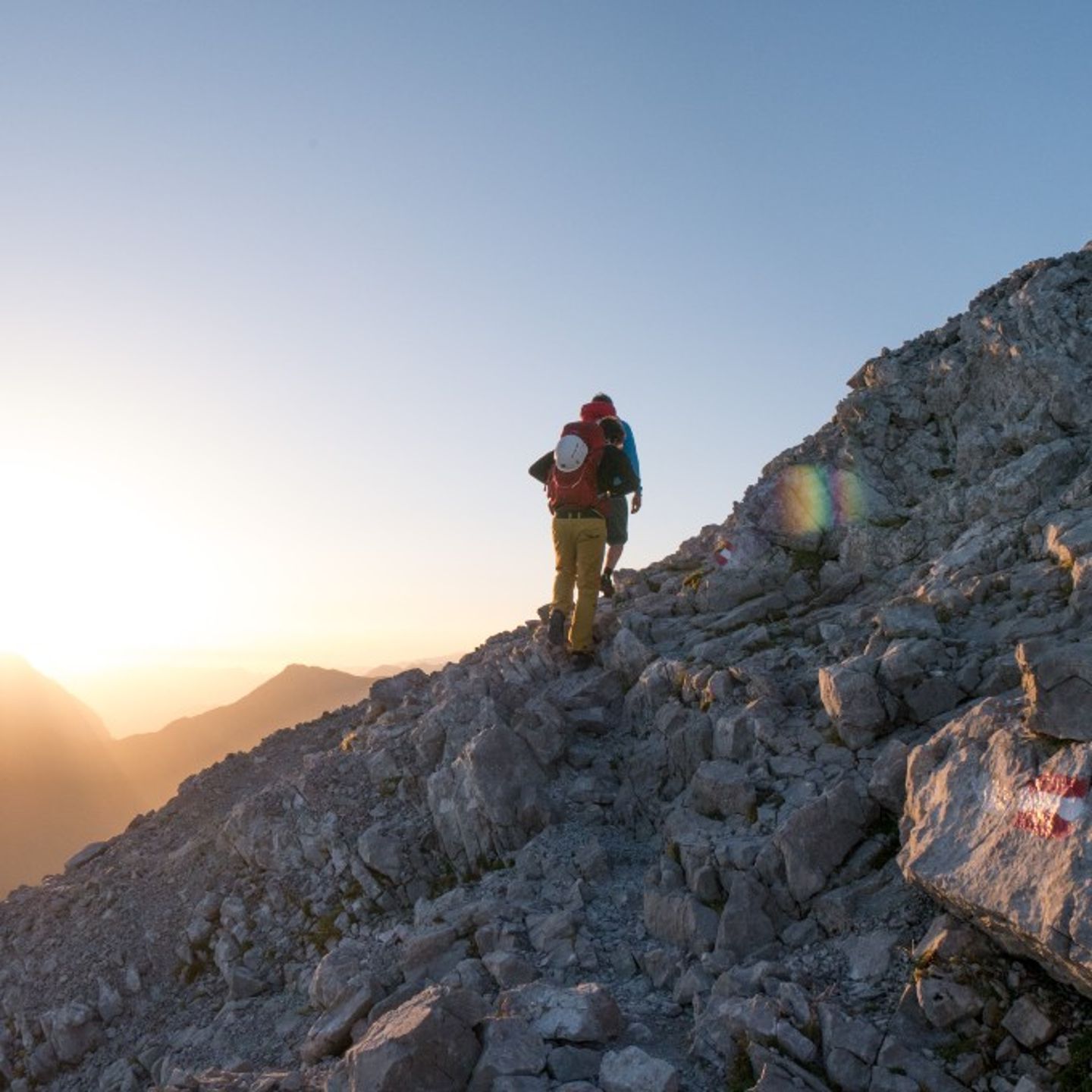 Person on peak at sunrise