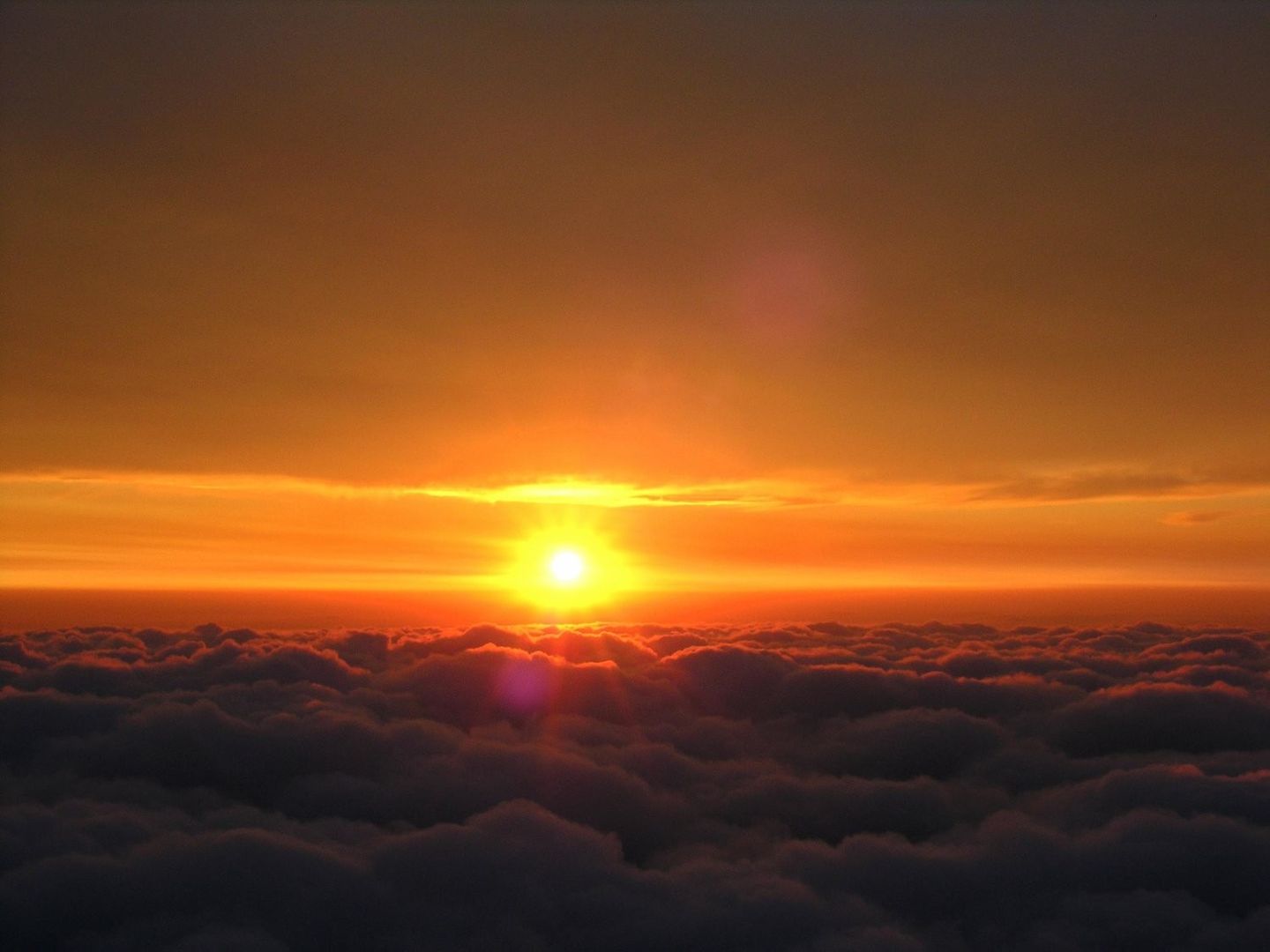Sunset over clouds
