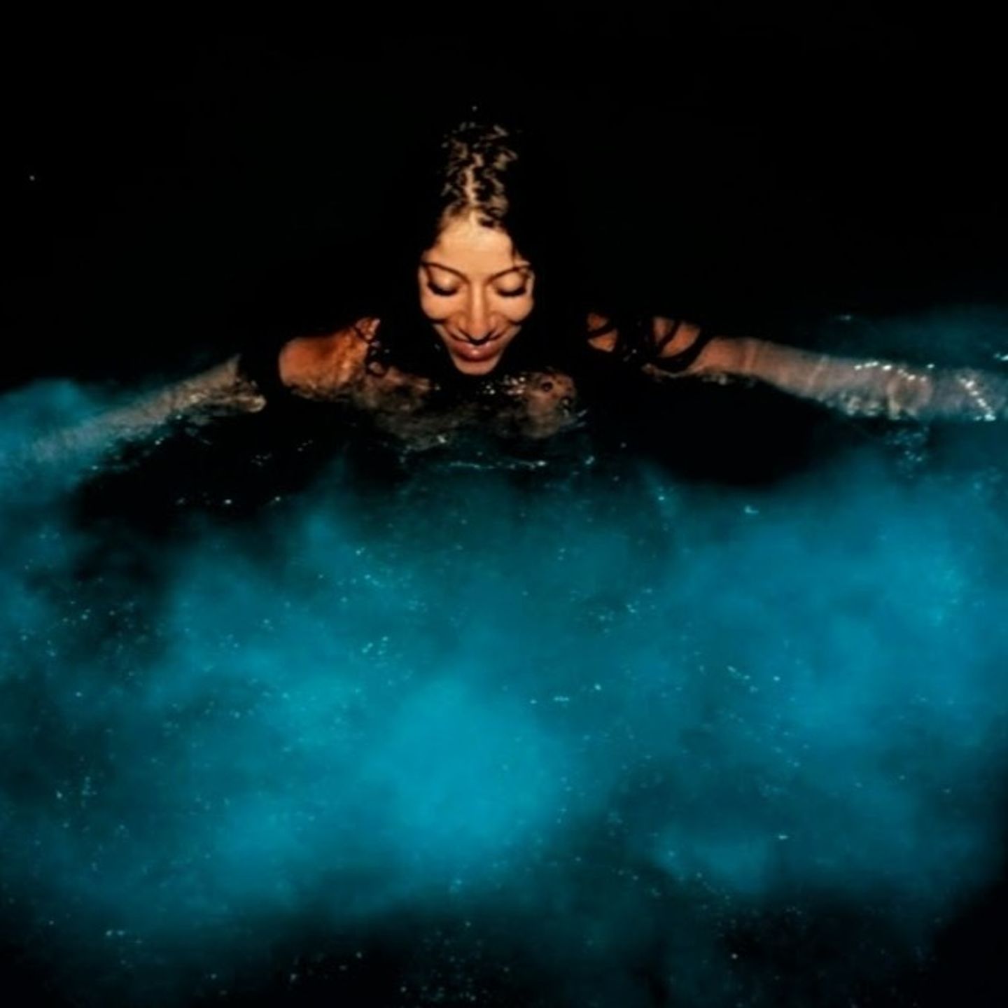 Girl Swimming in Bioluminescence