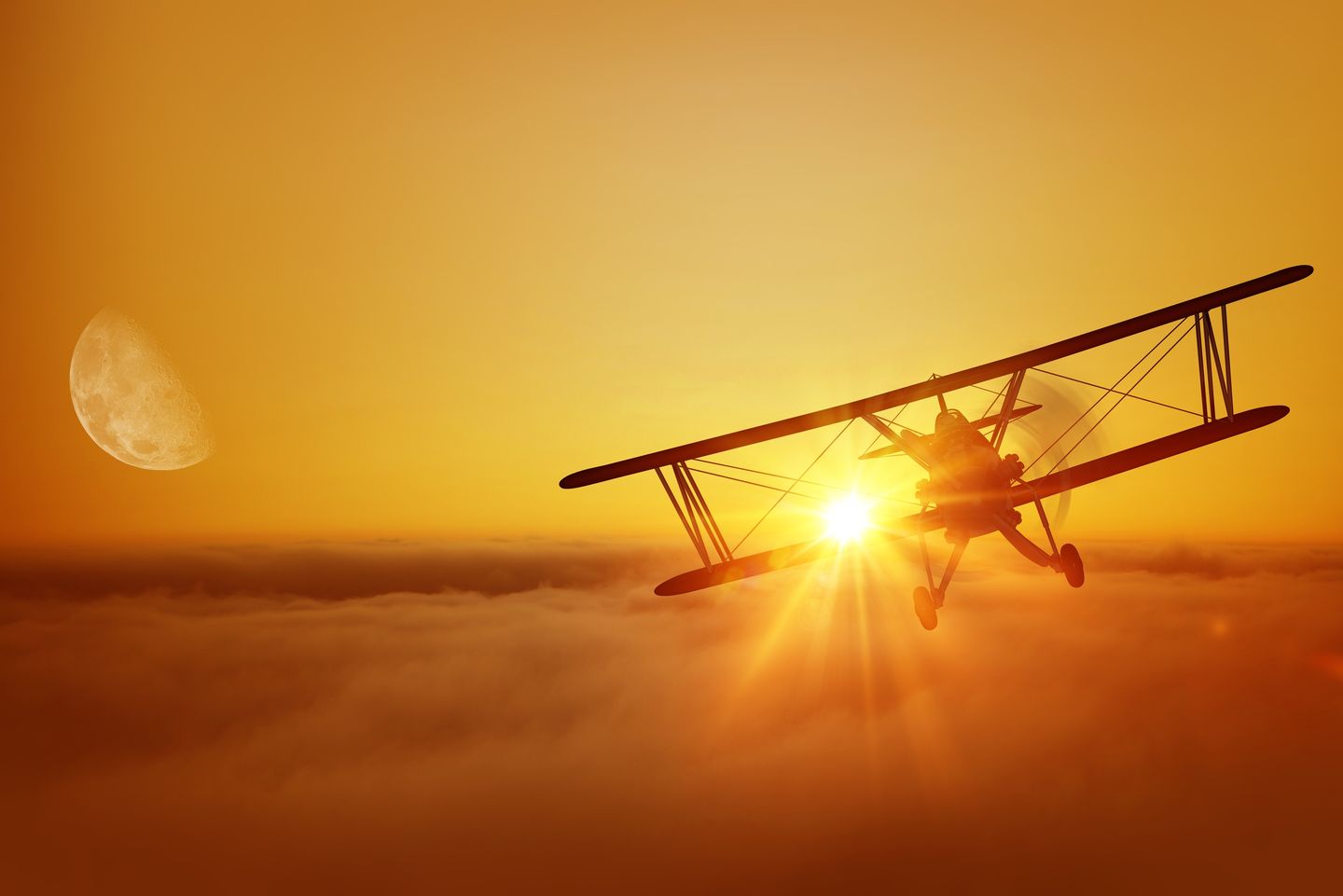 Biplane at sunset